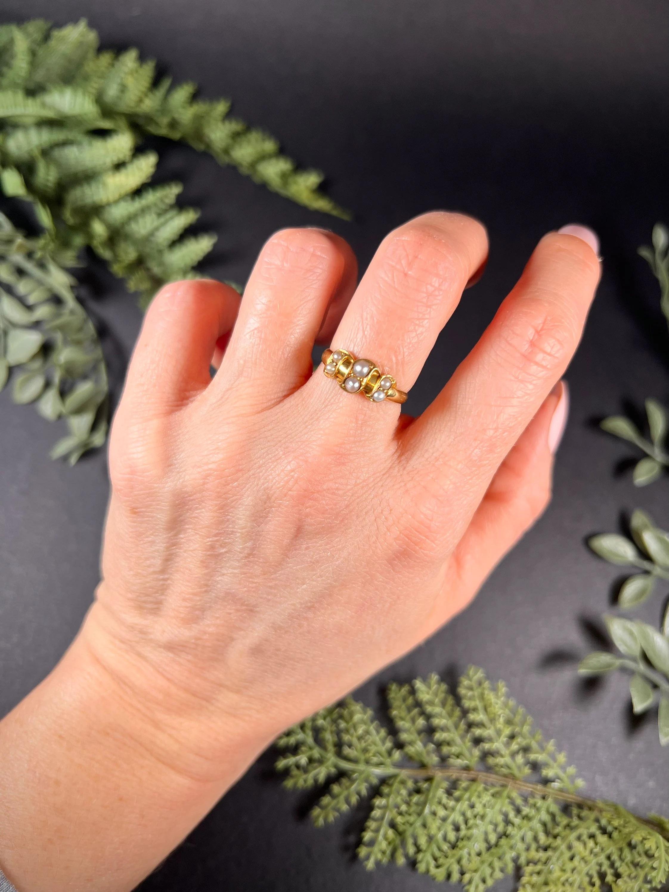 Antique Pearl Ring 

18ct Gold Stamped 

Circa 1900

Hallmarked Birmingham- The date letter has rubbed. 

Makers Mark L & W

Lovely, Edwardian gold ring. Set with six pretty, natural seed pearls arranged in lovely pairs. 

Face of the ring measures