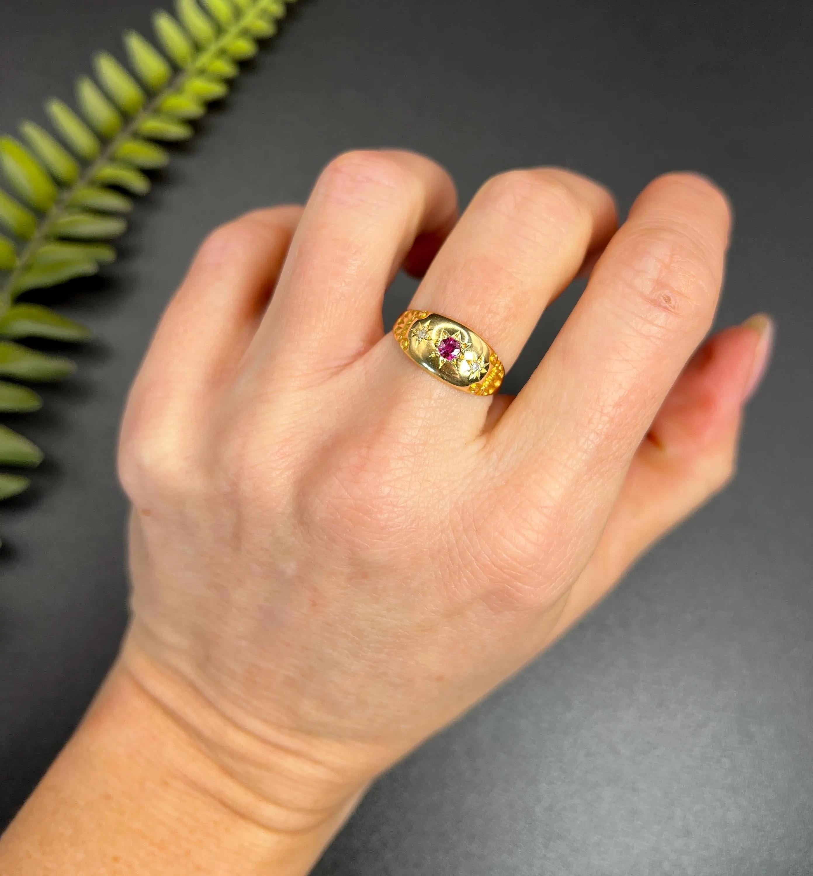 Antique Gypsy Ring 

18ct Gold Hallmarked London Chester

Circa 1910

Step back in time with this stunning Edwardian three-stone ring, crafted from radiant 18ct yellow gold. This exquisite piece showcases a vibrant natural ruby in the centre,