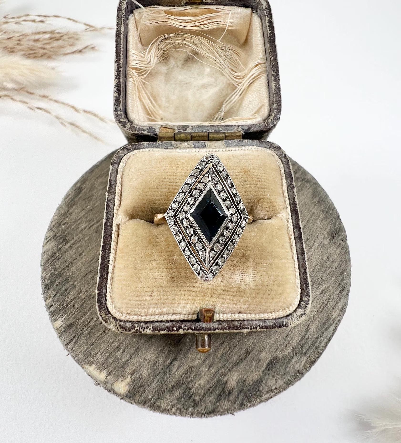 Antique Sapphire & Diamond Marquise Ring

18ct Gold Tested

Circa 1900

Introducing a stunning Edwardian 18ct gold sapphire and diamond ring. This exquisite navette/marquise-shaped ring features a central natural Lozenge cut sapphire surrounded by a