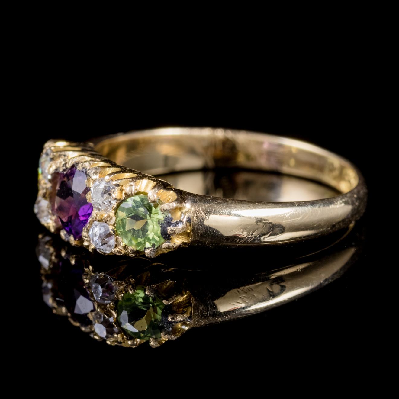 A fabulous antique Edwardian Suffragette ring adorned with a violet 0.22ct Amethyst flanked by green 0.15ct Peridots and four 0.05ct Diamonds. 

Suffragettes liked to be depicted as feminine, their jewellery popularly consisted of Violet, Green and