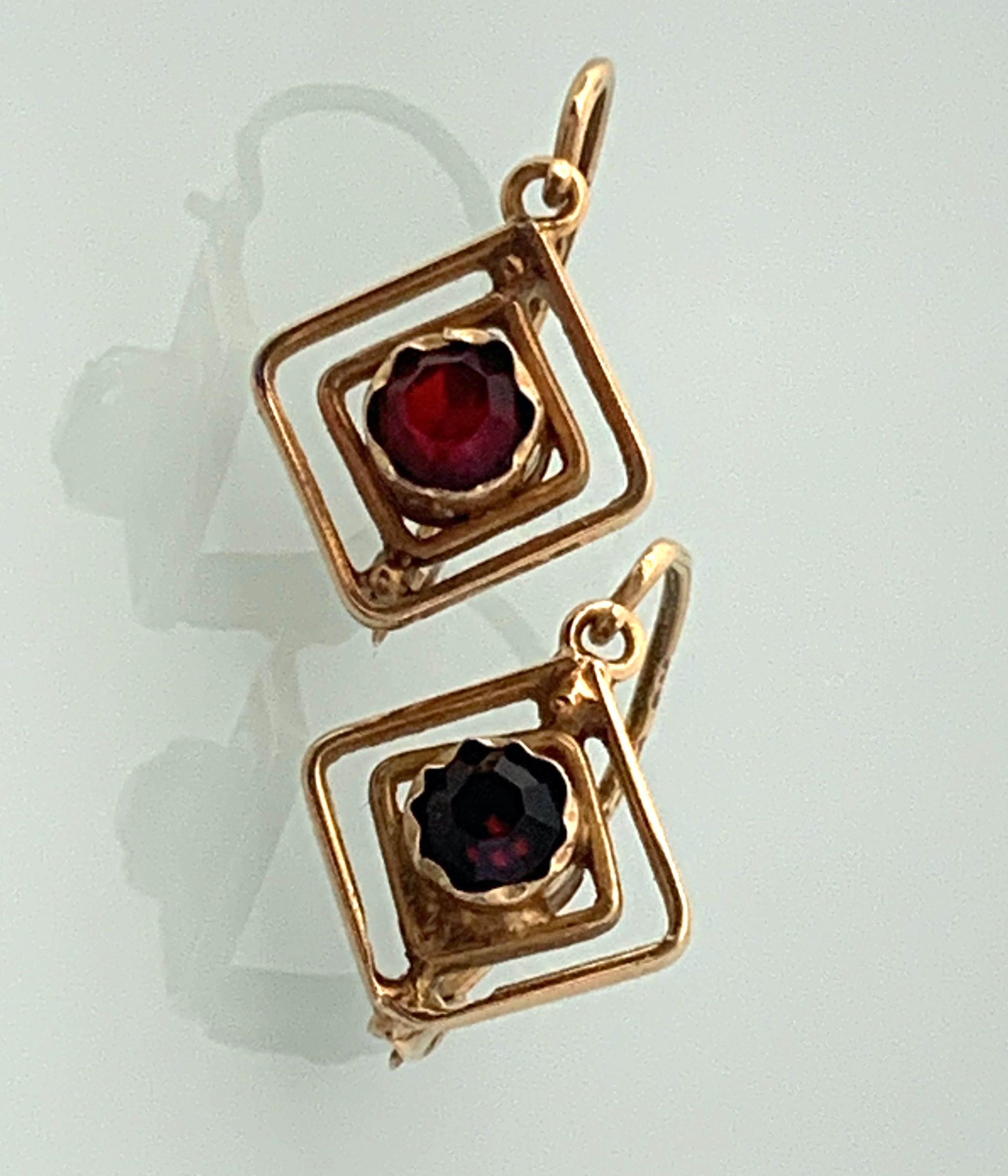 Antique 18ct Gold Gem set Earrings
Diamond Shaped in Design
unknown origin
European markings 
with central unknown stones - maroon red in colour
Forward hinge fastening.
Earrings are exquisitely hand crafted