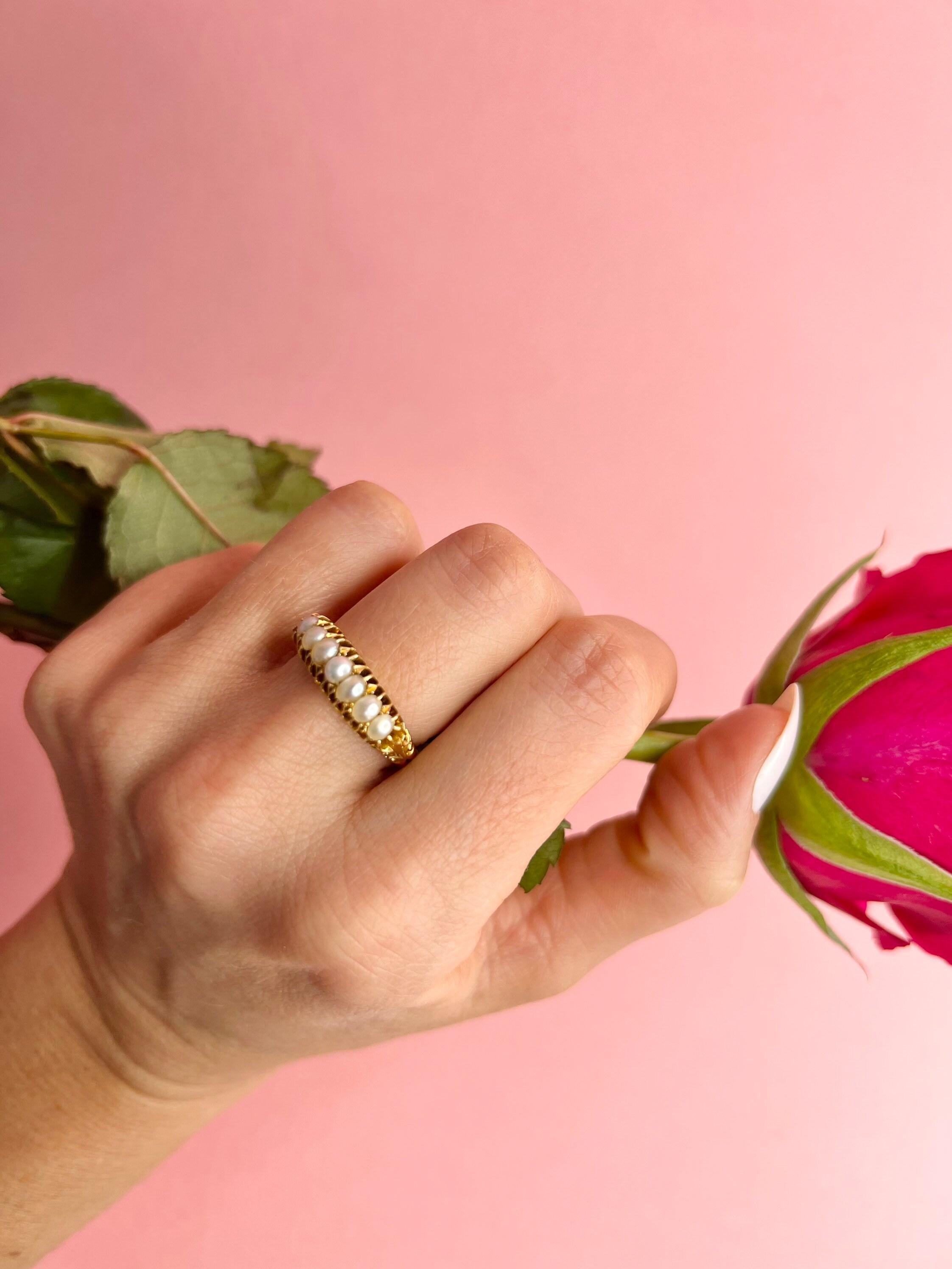 Antique Pearl Ring 

18ct Gold 

Edwardian Hallmarked Chester 1903

Makers Mark H C & S Ltd 

Gorgeous Edwardian Carved Ring, Set with Seven Fabulous Pearls & Beautiful Scroll Shoulders 

UK Size Q 1/2

US Size 8 1/4

Can be resized using our