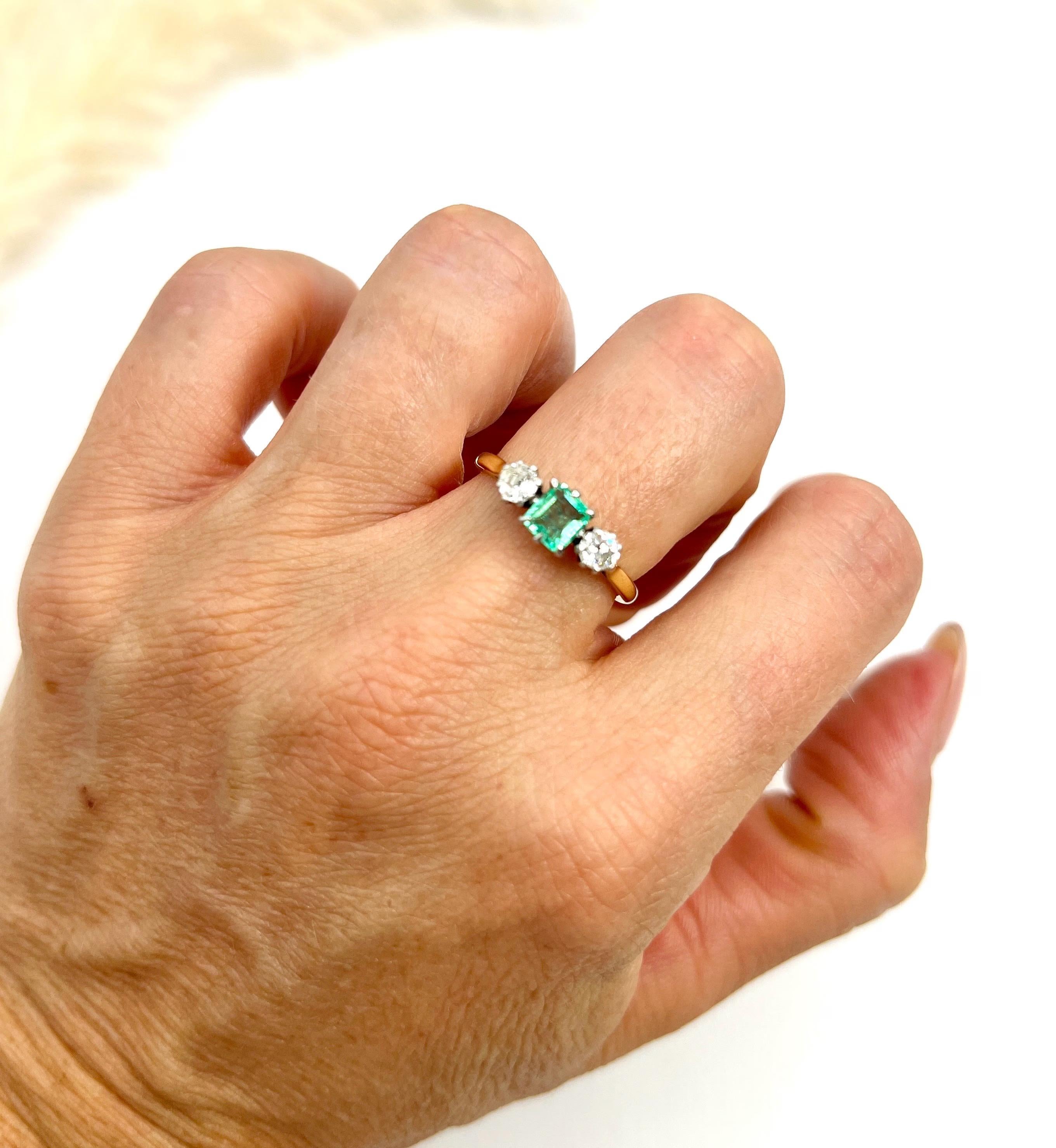 Antique Emerald & Diamond Trilogy Ring

18ct Gold & Platinum Stamped

Circa 1920s

This stunning trilogy ring from the 1920s is a true antique beauty. The ring is crafted in 18ct yellow gold and features a natural square-cut emerald and two natural