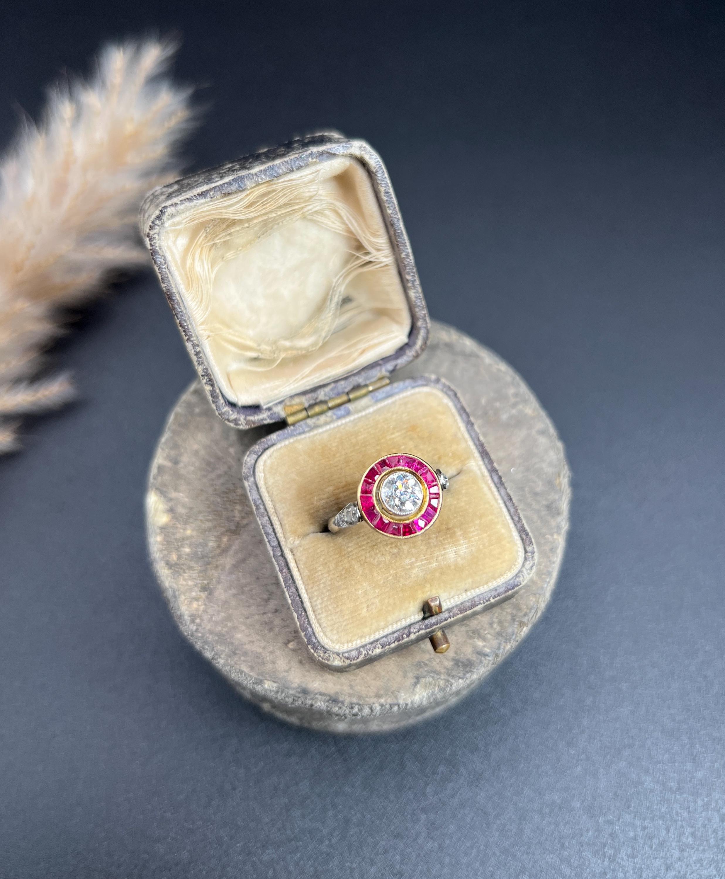 Antique Target Ring 

18ct Yellow Gold & Platinum

Circa 1920s

Step into the elegance of the Art Deco era with this stunning original target ring, crafted from 18ct yellow gold and platinum. Featuring a captivating centre diamond weighing