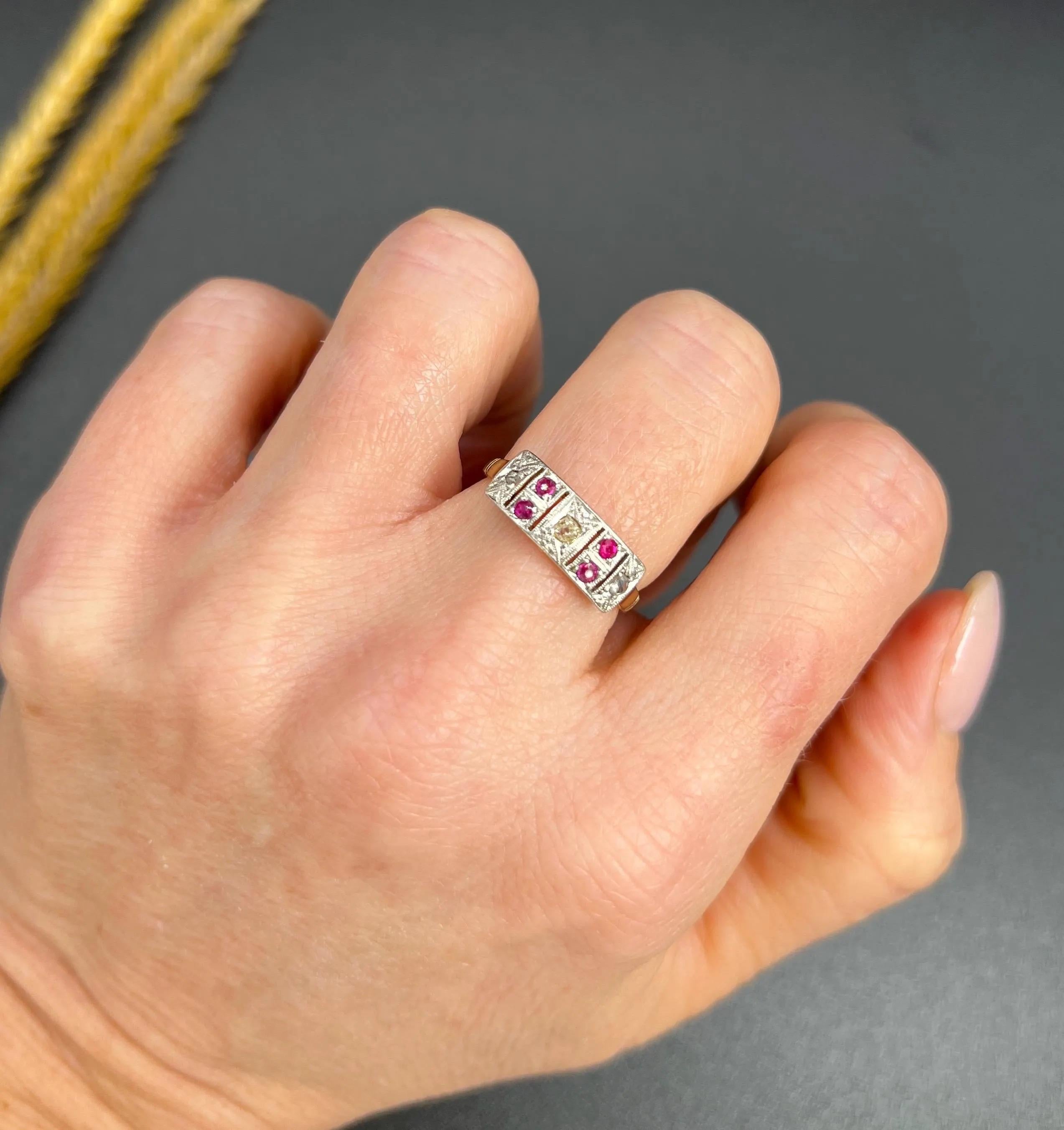 Antique Plaque Ring 

18ct Gold & Platinum

Circa 1920s

Step back in time with this exquisite 1920s plaque-style ring, artfully crafted in 18ct gold and platinum. The ring features a breathtaking arrangement of natural rubies and diamonds,