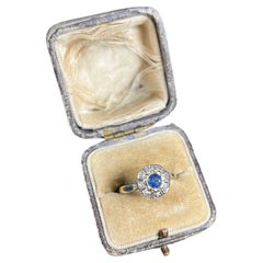 Bague grappe Art déco ancienne en or 18 carats et platine, saphirs et diamants marguerite