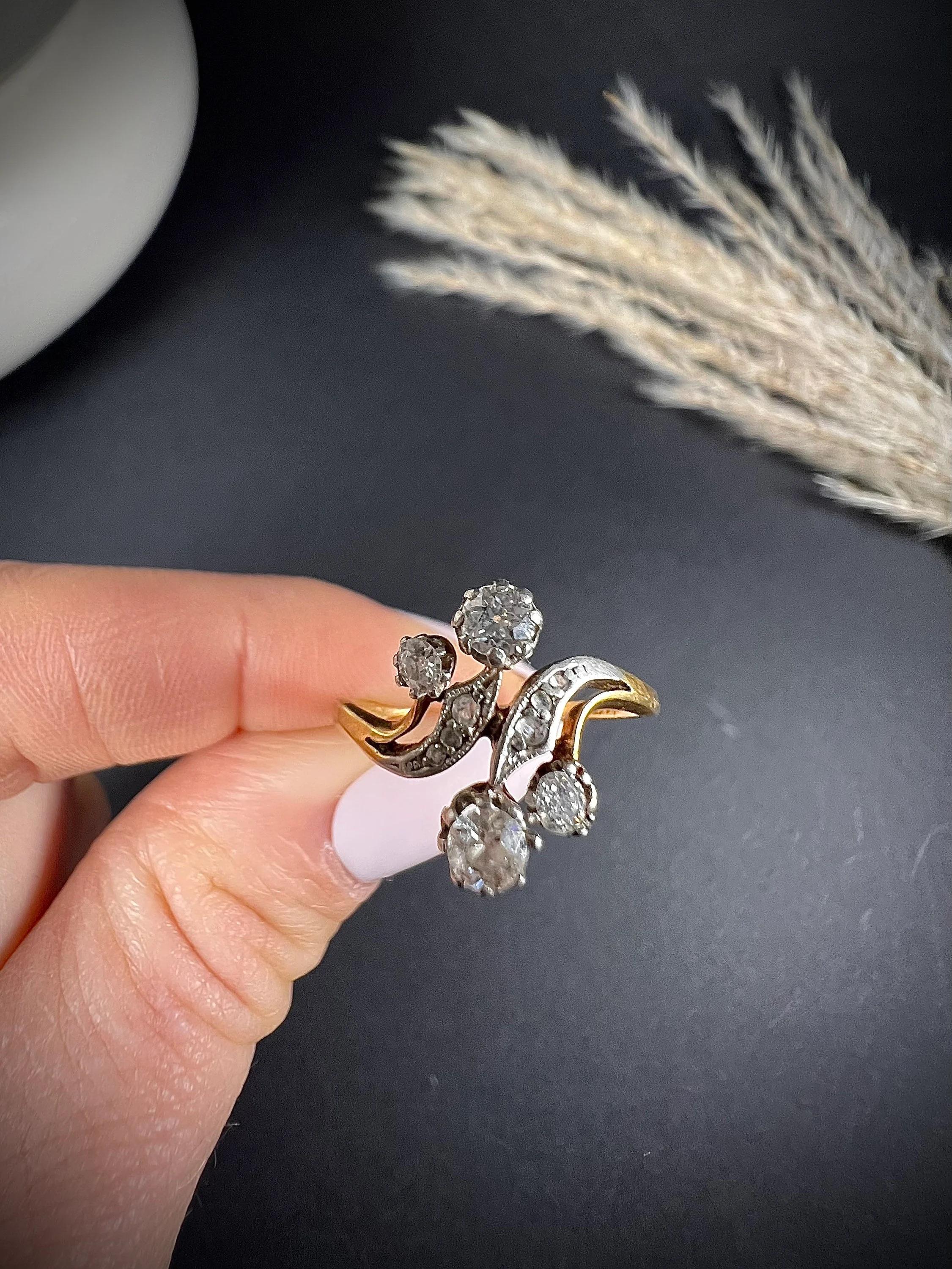 Antique Belle Époque Ring 

18ct Gold & Platinum Tested

Circa 1900

Fabulous, Belle Époque Ring. Set with four, beautiful- claw set- diamonds & pretty, diamond crossover shoulders. The diamonds are set in platinum & mounted on an 18ct yellow gold