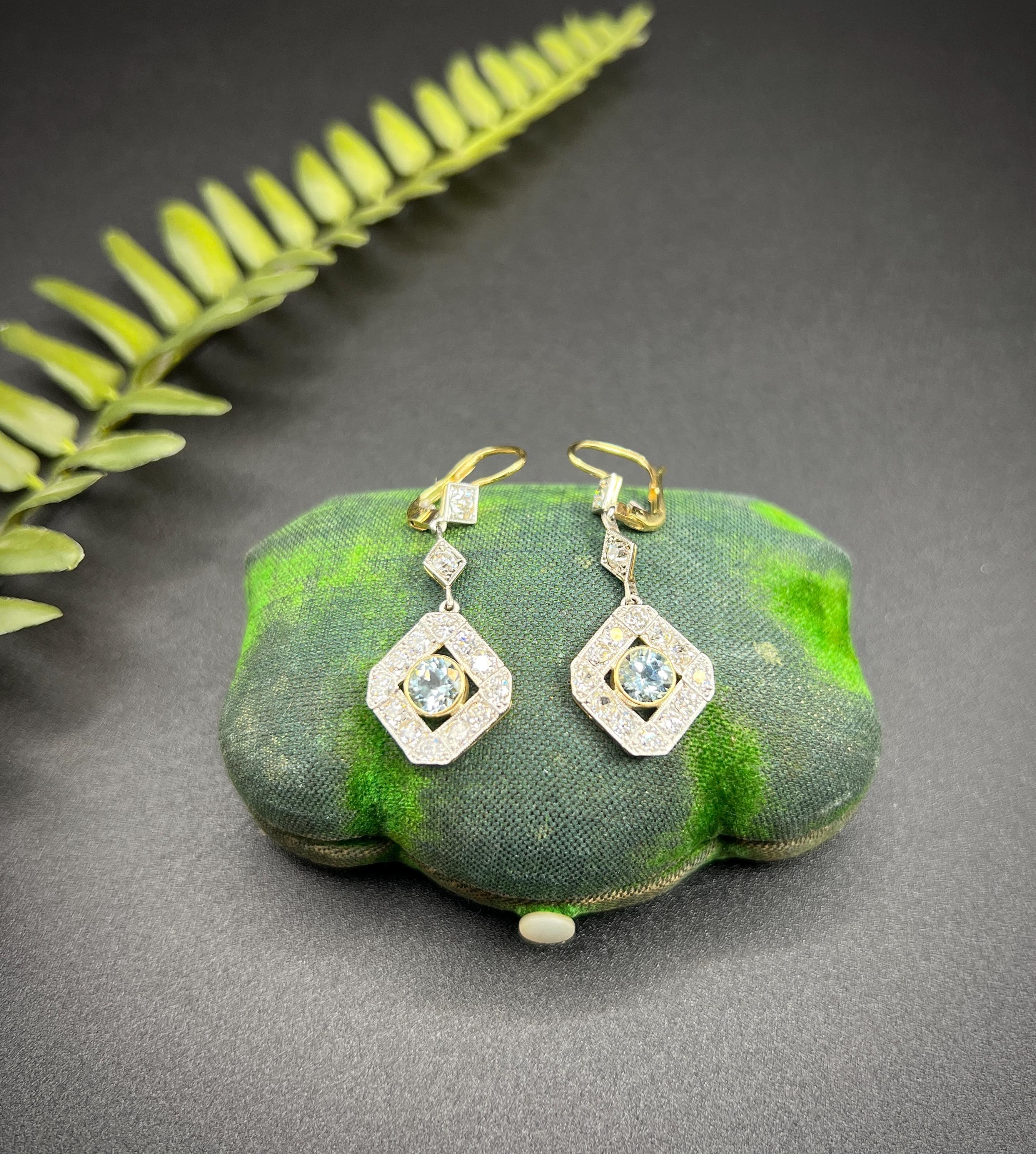 Antique Aquamarine Drop Earrings 

18ct Gold & Platinum Tested

Circa 1910

Introducing a stunning pair of Edwardian dangle earrings, expertly crafted in 18ct gold and platinum. These exquisite earrings feature a captivating central aquamarine