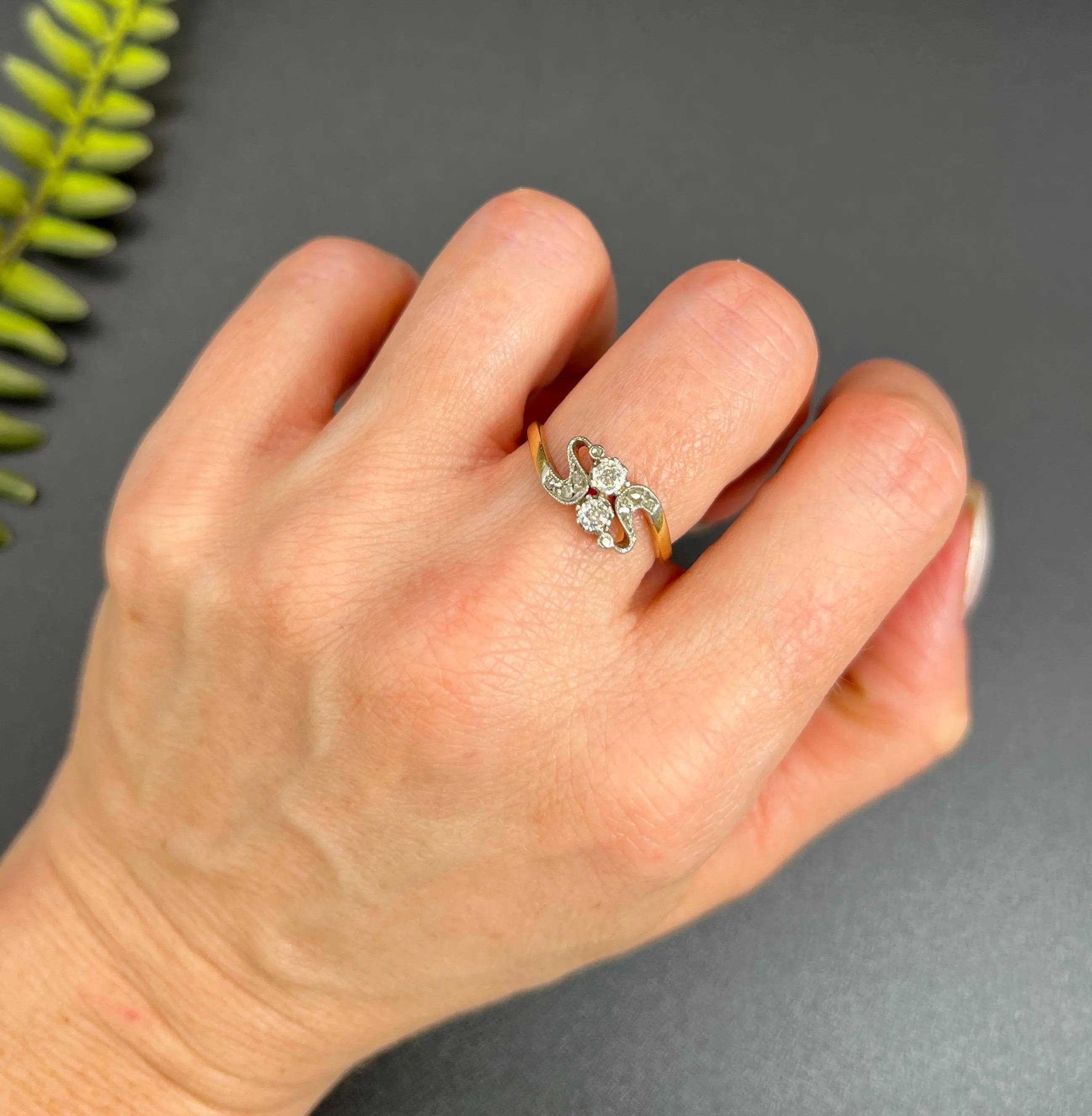 Antique Belle Époque Ring 

18ct Gold

Circa 1900

This exquisite 18ct yellow gold and platinum Edwardian ring beautifully embodies the elegance of the Belle Époque era. Featuring a stunning “Toi et Moi” design, the ring showcases two sparkling
