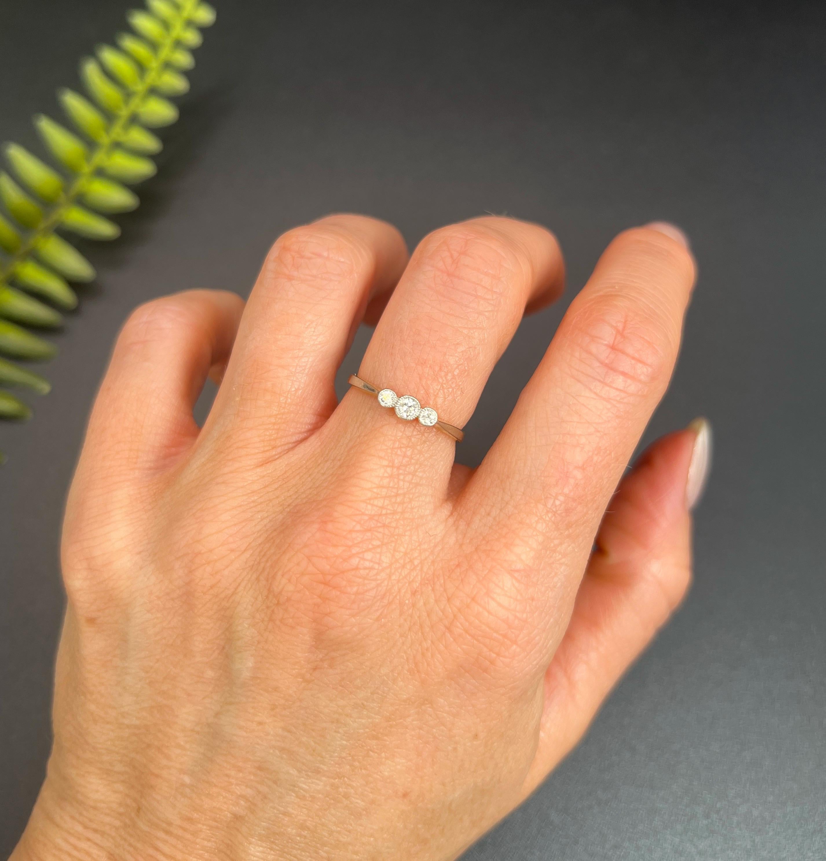 Antique Diamond Ring 

18ct Gold & Platinum

Circa 1910

Behold this stunning Edwardian-era diamond trilogy ring, a timeless piece exuding elegance and grace. This exquisite ring features three enchanting, natural diamonds nestled in platinum