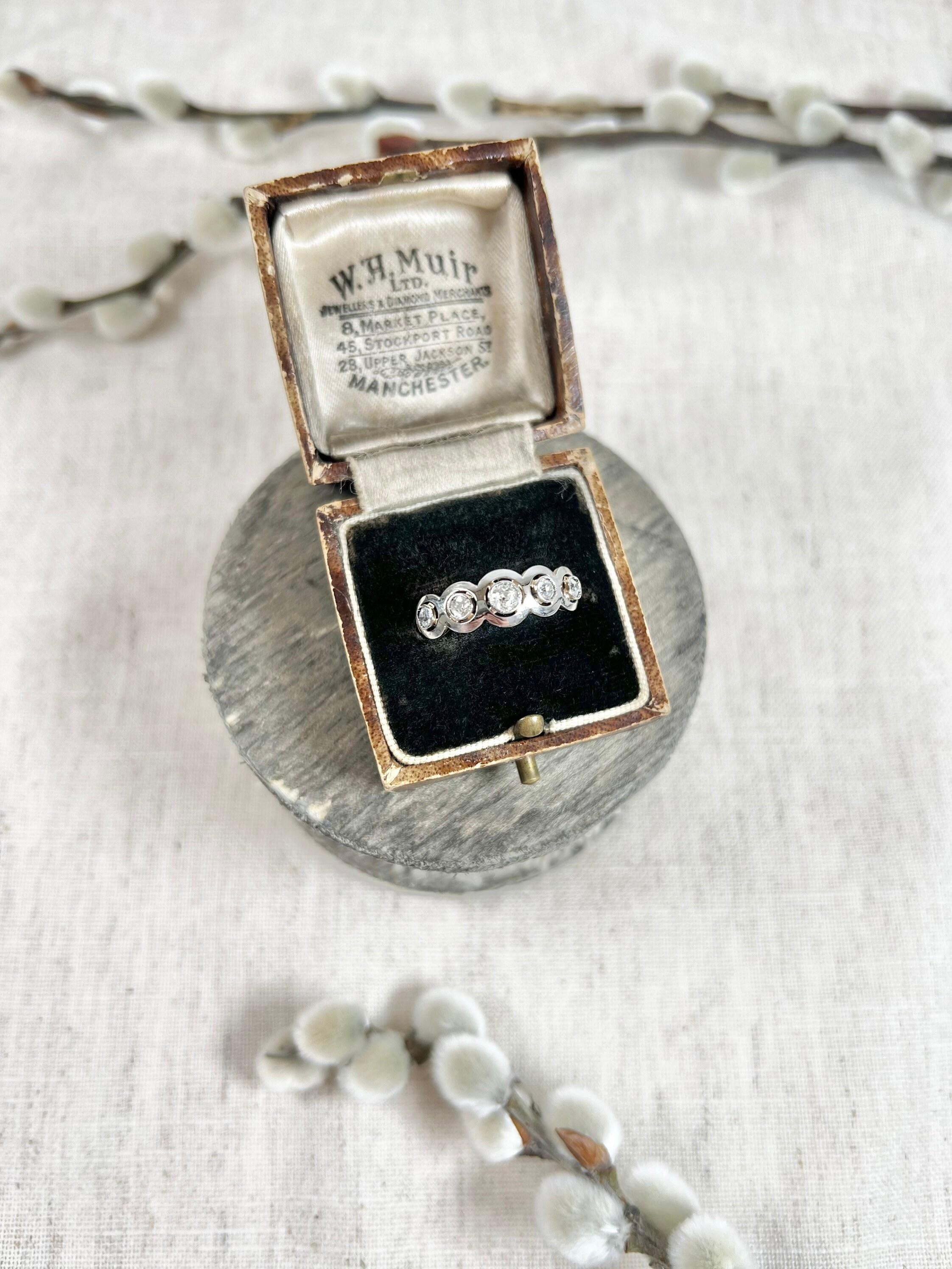 Antique Five Stone Ring 

18ct Gold & Platinum Tested

Circa 1910

Beautiful, Edwardian five stone diamond ring. 
Features gorgeous target style settings. The natural diamonds are set in platinum & mounted on an 18ct yellow gold band. 

Ring measure