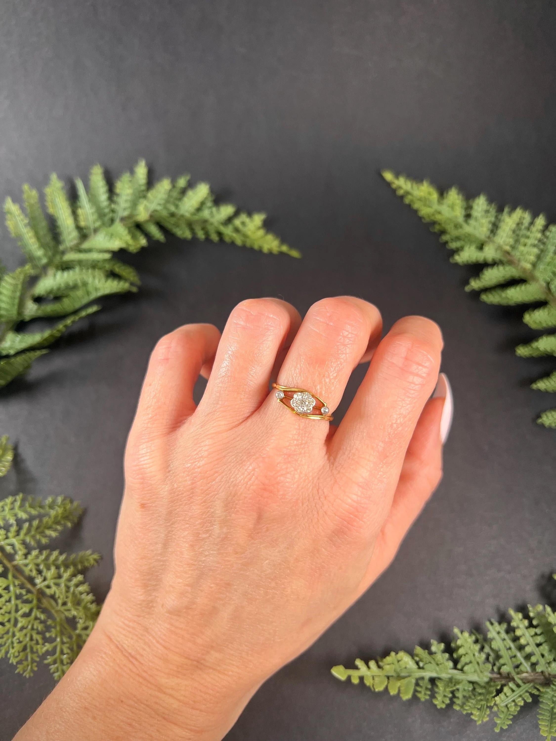 Antique Diamond Daisy Ring 

18ct Gold & Platinum Stamped

Circa 1910

This stunning antique ring is truly a sight to behold. Crafted from 18ct gold and platinum, this ring features a beautiful daisy formation at the centre, formed by old European