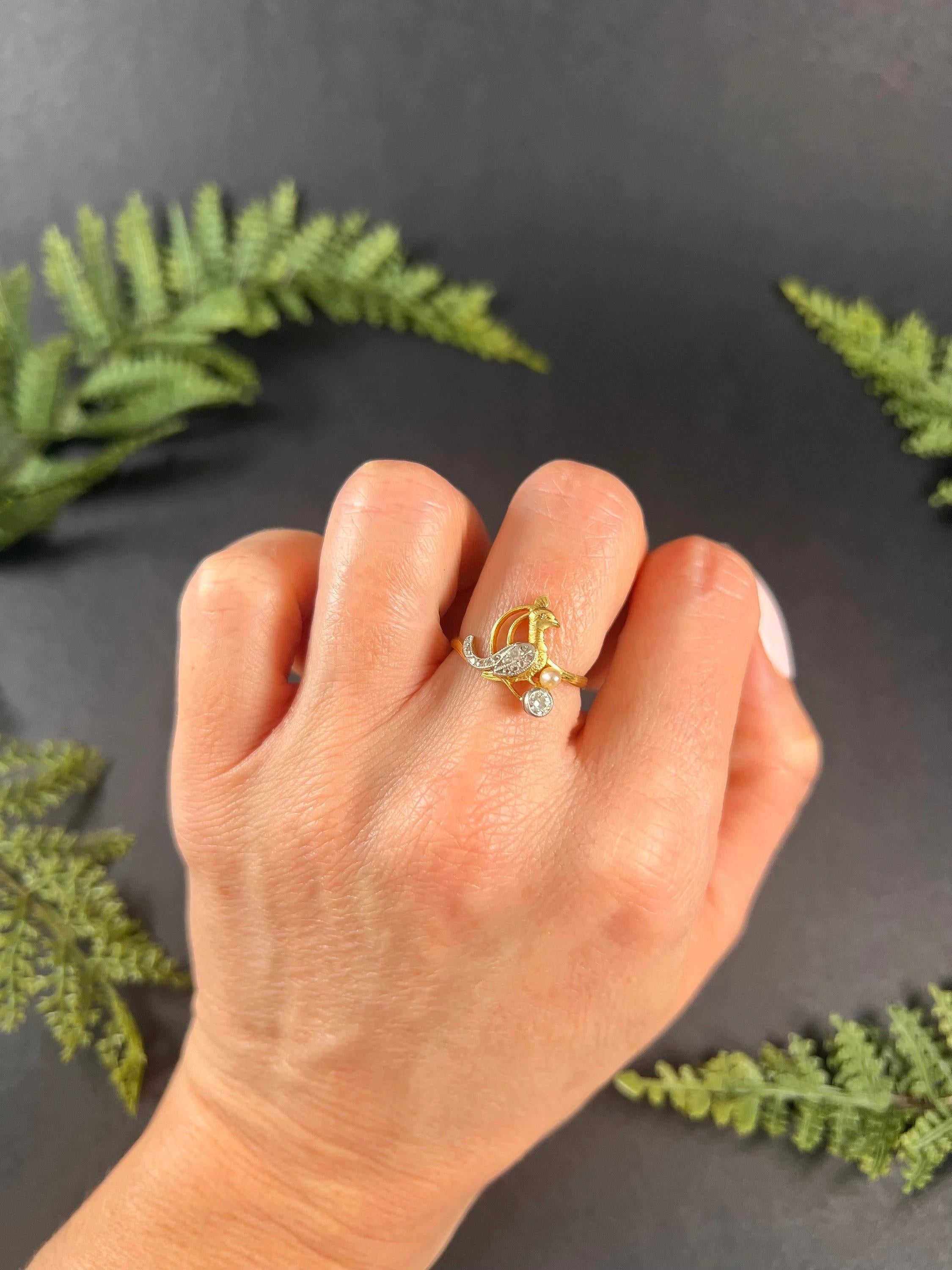 Antique Art Nouveau Bird Ring 

18ct Yellow Gold Stamped

Circa 1900

This exquisite 18ct gold Art Nouveau bird ring is a true masterpiece. The ring features a beautifully crafted peacock-style bird with Rose cut diamond-set feathers that shimmer