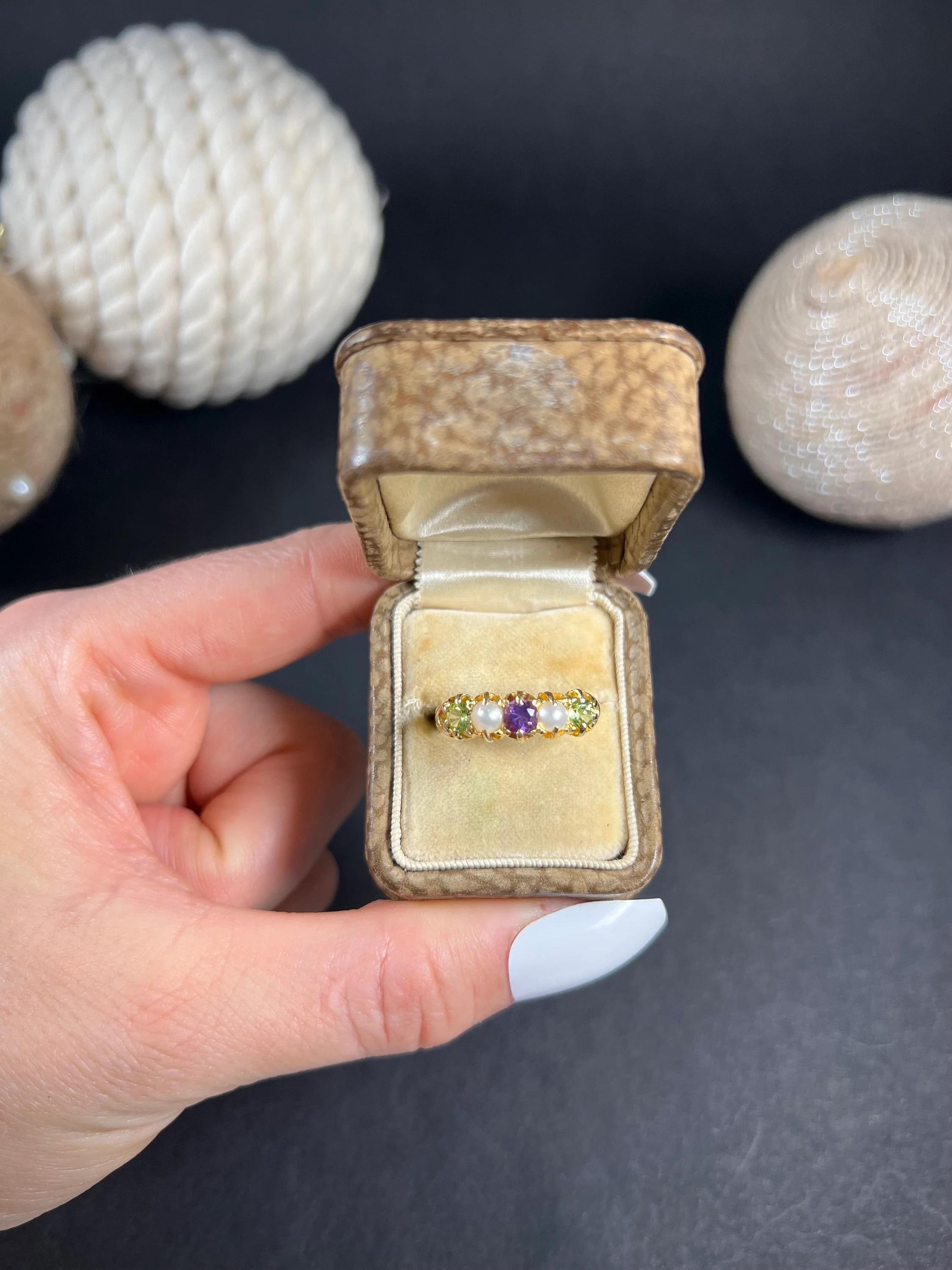 Antique Suffragette Ring 

18ct Yellow Gold Stamped 

This exquisite Edwardian suffragette ring is a true piece of art. Crafted from 18ct yellow gold, it boasts a stunning combination of amethyst, peridot, and pearl stones, which are beautifully set