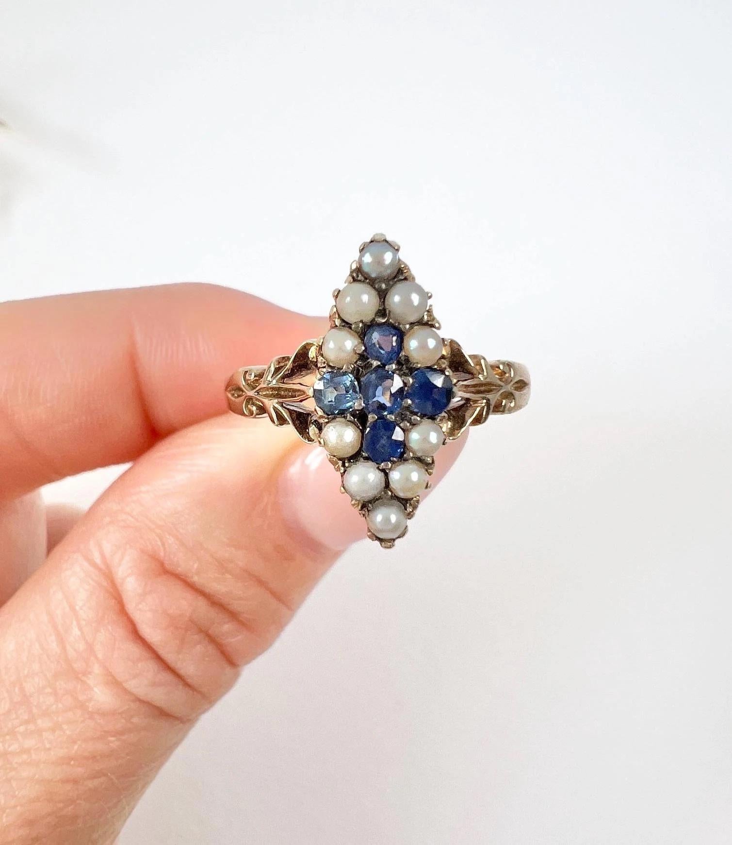Antique Sapphire & Pearl Marquise Ring

18ct Gold Stamped

Circa 1900

This stunning 18ct yellow gold Edwardian marquise/navette-shaped ring is beautifully set with natural sapphires in a cross formation, further enhanced by the surrounding natural