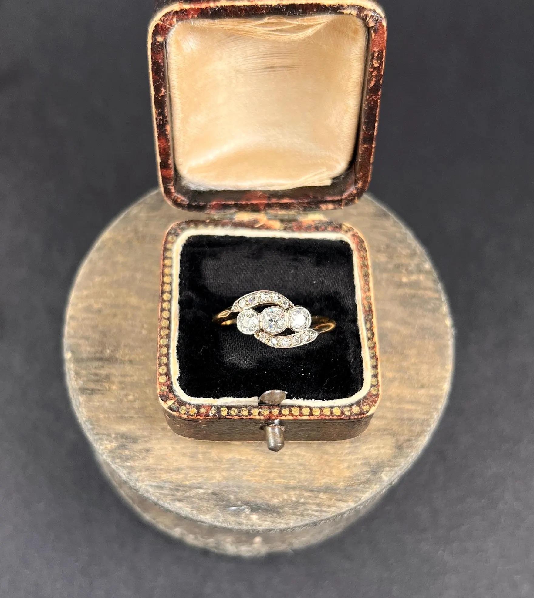 Antique Diamond Ring

18ct Gold Tested 

Circa 1910

Introducing a stunning Edwardian trilogy ring crafted from 18ct gold, featuring approximately 0.75cts of natural old European cut and cushion cut diamonds. The trilogy design is elegantly