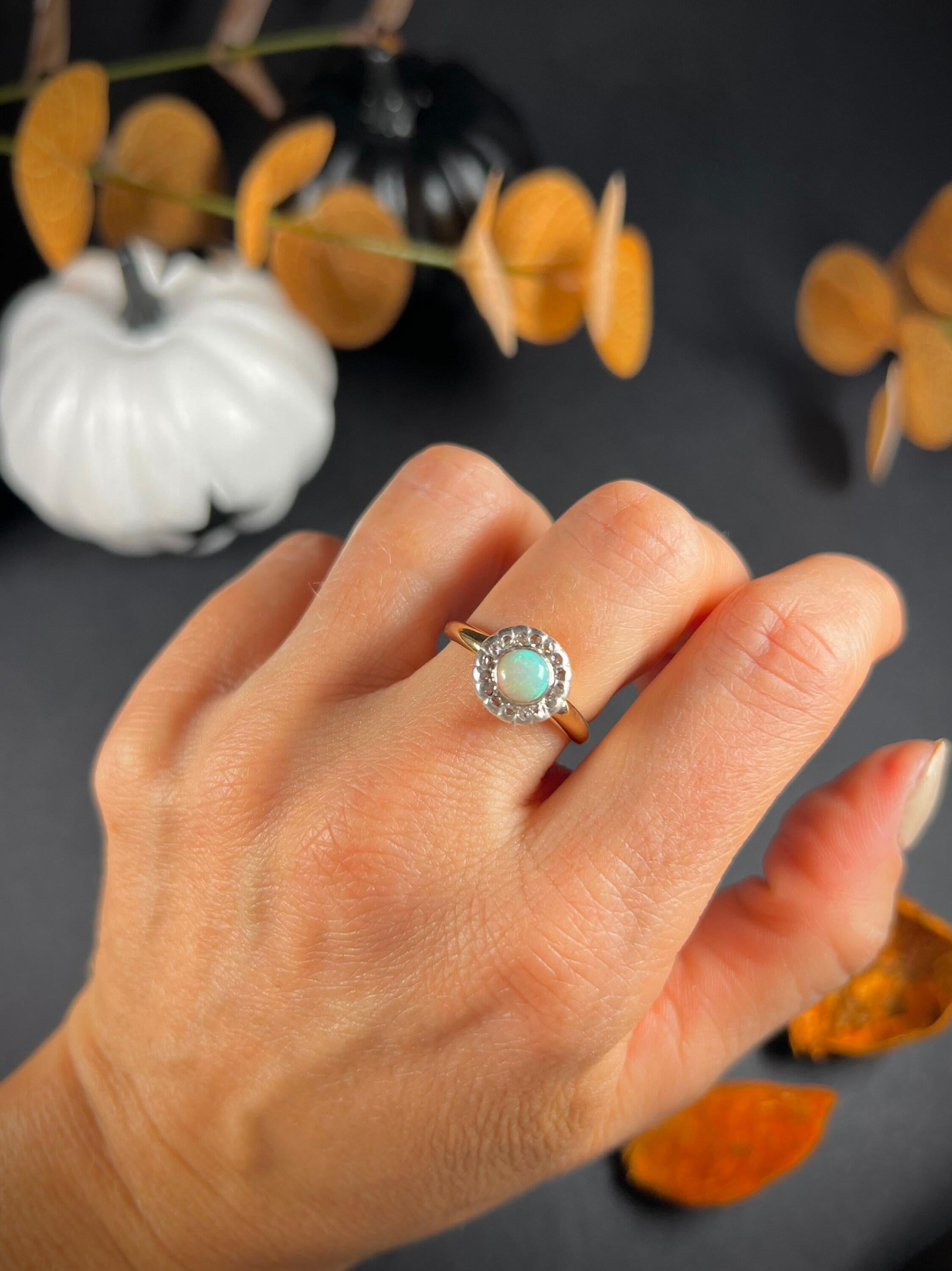 Antique Opal & Diamond Ring 

18ct Gold Tested 

Circa 1880’s 

Beautiful, Victorian ring set with a gorgeous natural opal centre & halo of glittering, natural diamonds. The stones are set in silver & mounted on an 18ct gold band. 
The ring has been