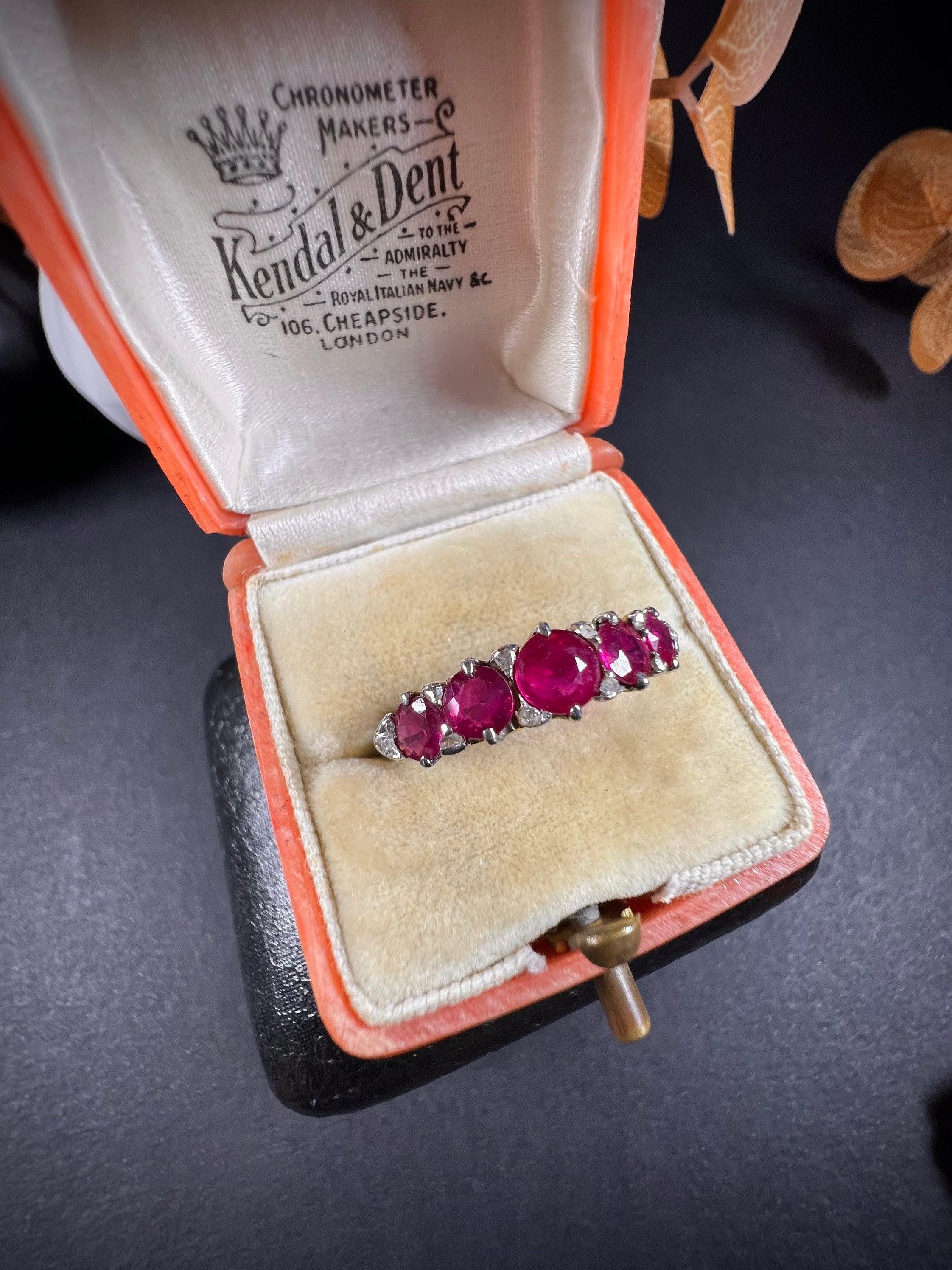 Antique Ruby Carved Ring 

18ct Gold

Makers Mark H G & S

Circa 1880

Fabulous, Victorian carved gold ring. Set with five, beautiful, bright, natural rubies & gorgeous, little rose cut diamonds in between. 
Mounted in a beautiful hand carved,