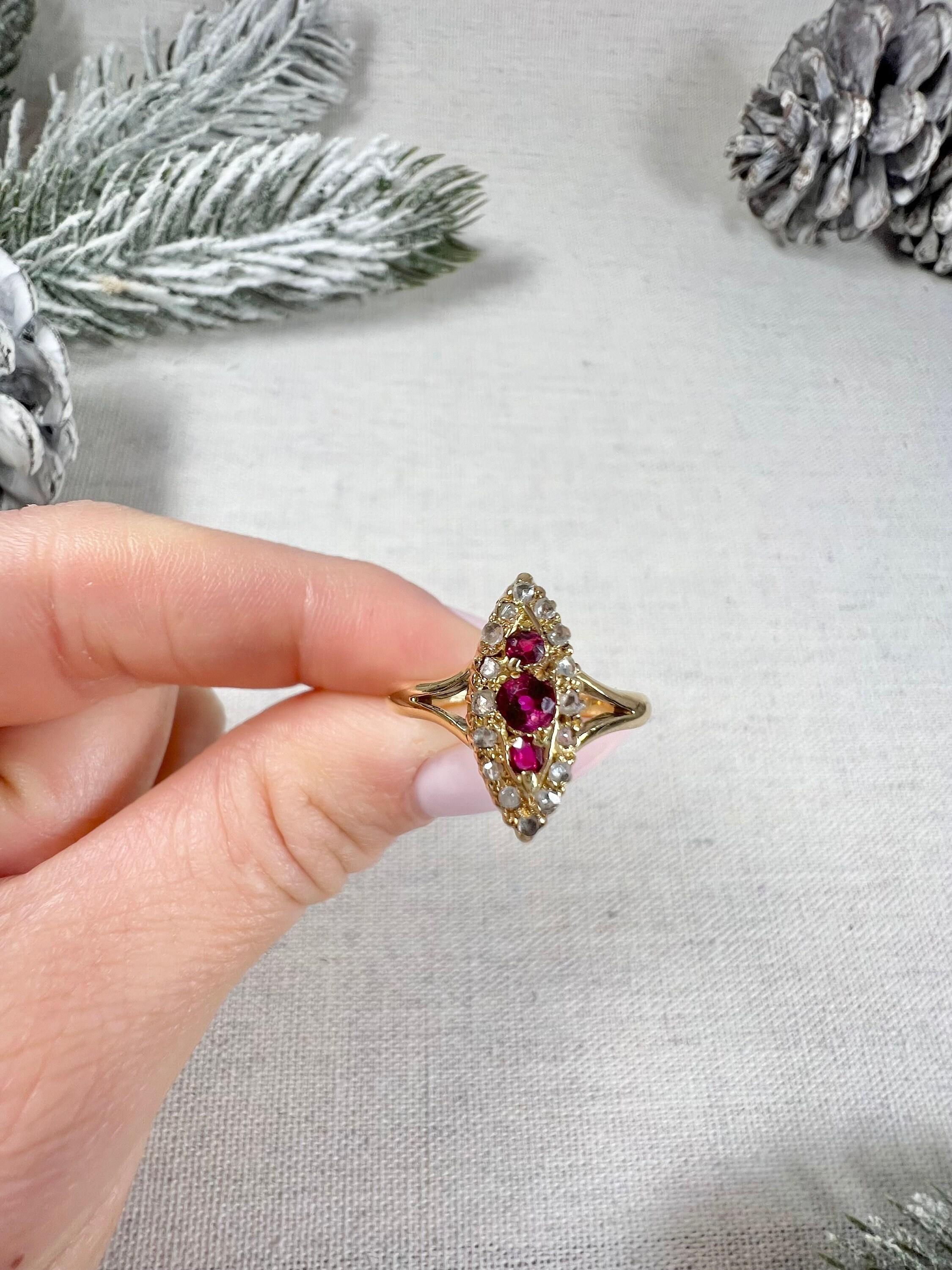Antique Ruby & Diamond Marquise Ring 

18ct Gold Tested

Circa 1880 

This Victorian marquise-shaped ring is a true beauty. Crafted from 18ct yellow gold, the ring features a row of three natural rubies set down the centre, each one sparkling with