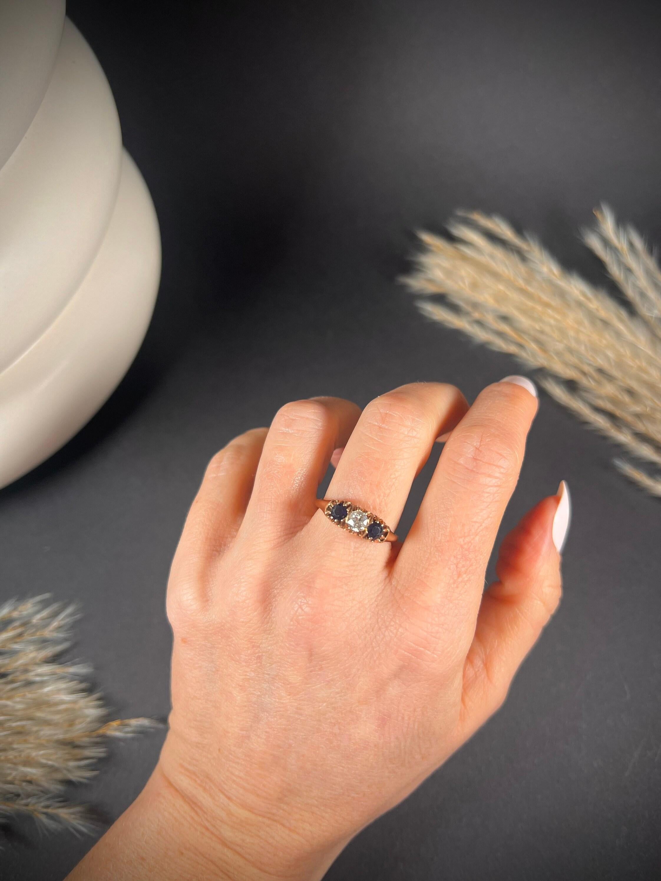 Antique Three Stone Ring 

18ct Rose Gold Tested 

Circa 1880

Beautiful, Victorian ring. Set with a centre, natural diamond & two beautiful, blue natural sapphires. 

Face of the ring measures approx height 5.7mm & width 14.5mm

UK Size P

US Size