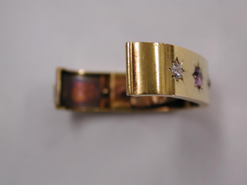 Antique 18ct Scarf Clip set with Amethyst and Diamonds, J W Benson Ltd, London
Very good quality scarf clip which is sprung loaded, with a  gold spike to hold the scarf in place.
Made about 1890 by a very prominent watchmakers ,silversmiths and