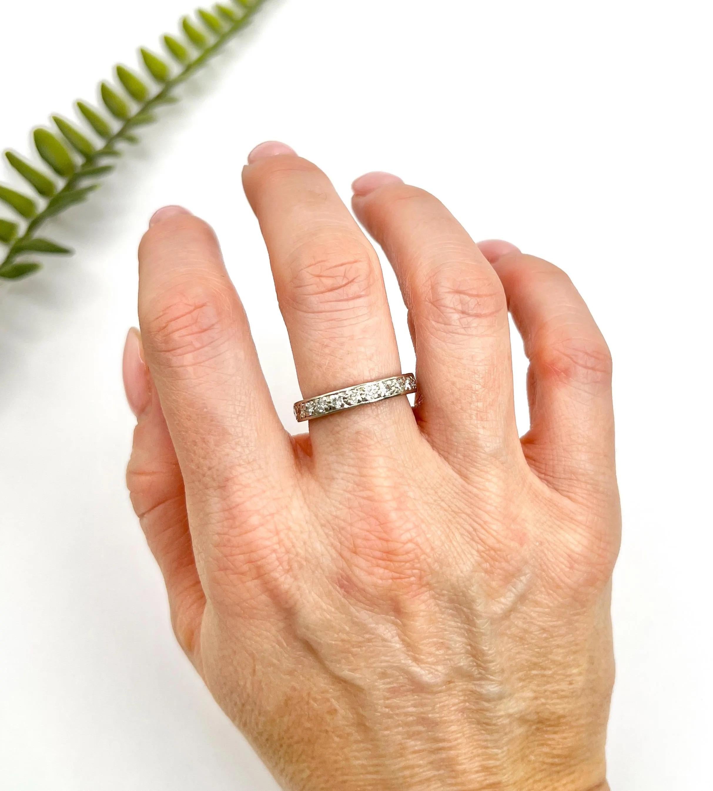 Antique Eternity Ring 

18ct White Gold Tested 

Circa 1920s

This exquisite 18ct white gold eternity ring is a stunning piece, fully set with approximately 1.0 carats of natural diamonds that sparkle and shine brilliantly. The ring is designed to