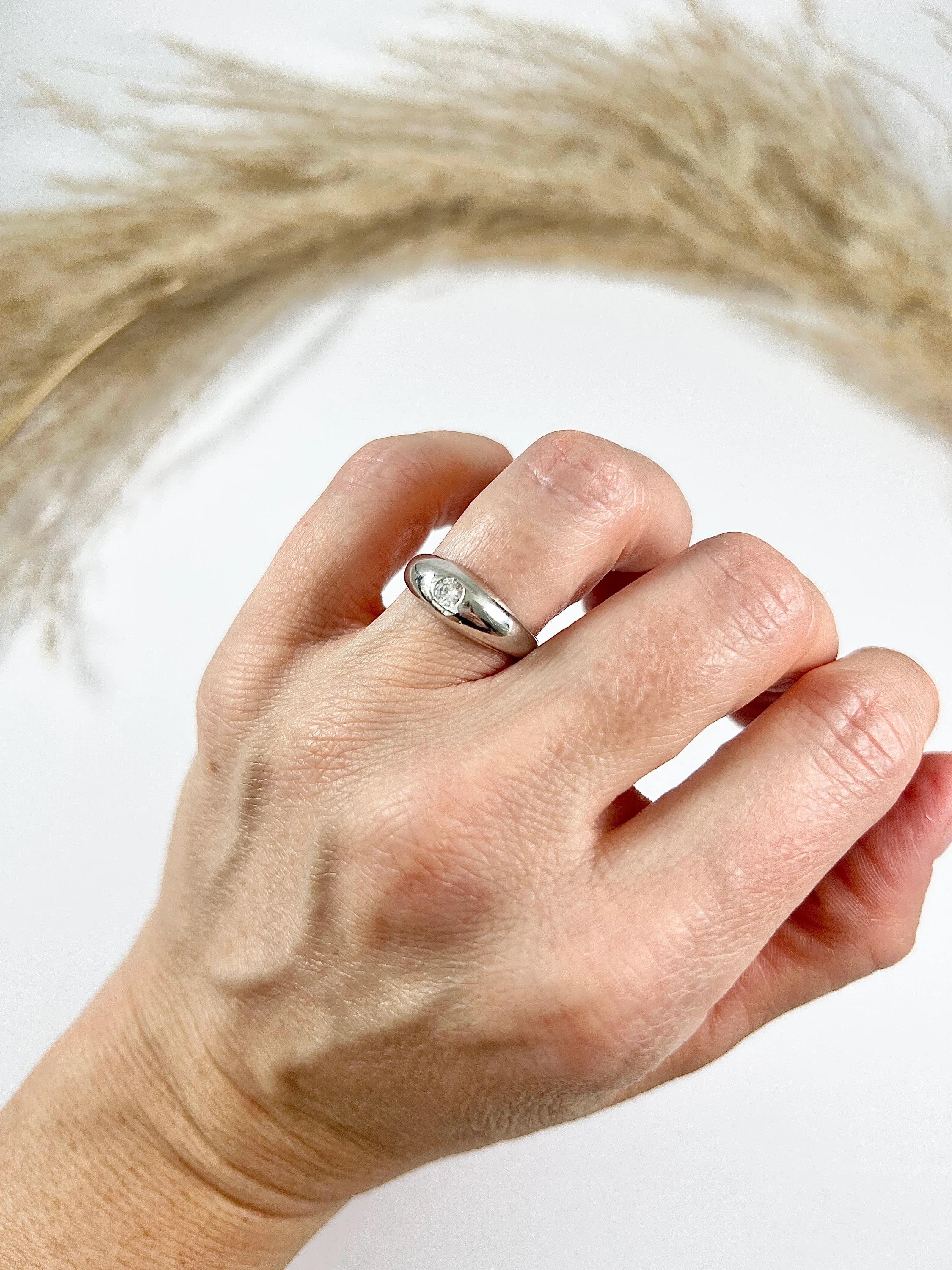 Antique Diamond Band

18ct White Gold French Stamped 

Circa 1920s

This 18ct white gold band with a single French diamond is a classic and timeless piece of jewellery. The slightly domed shape, tapered back, and diamond accent gives it a