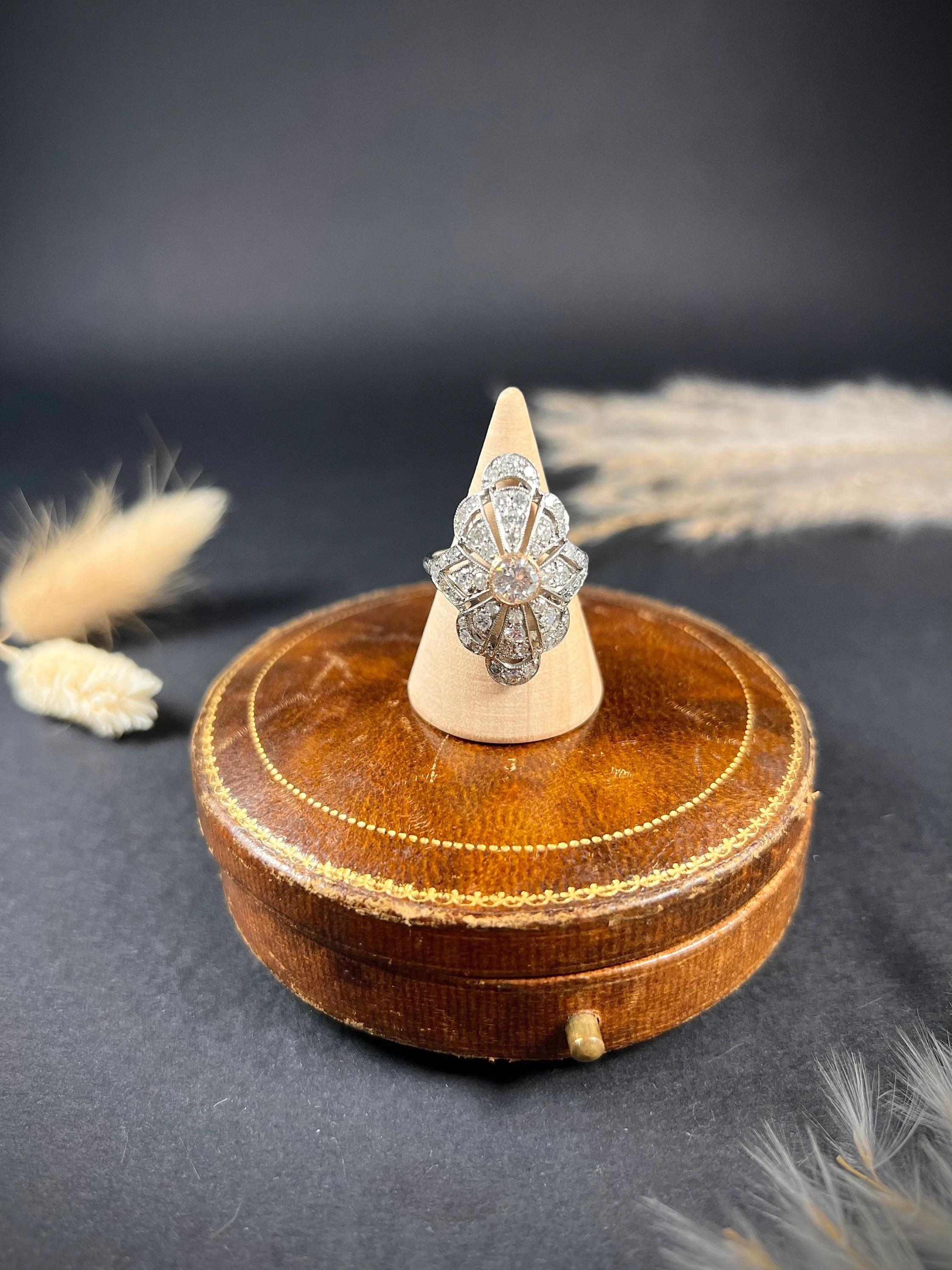 Antique Art Deco Ring

18ct Gold & Platinum Tested

Circa 1920’s

Fabulous, Art Deco bombe/dome design ring. Set with stunning, old cut diamonds through each of the eight fans. The centre stone is approximately 5mm in diameter with a gorgeous rose