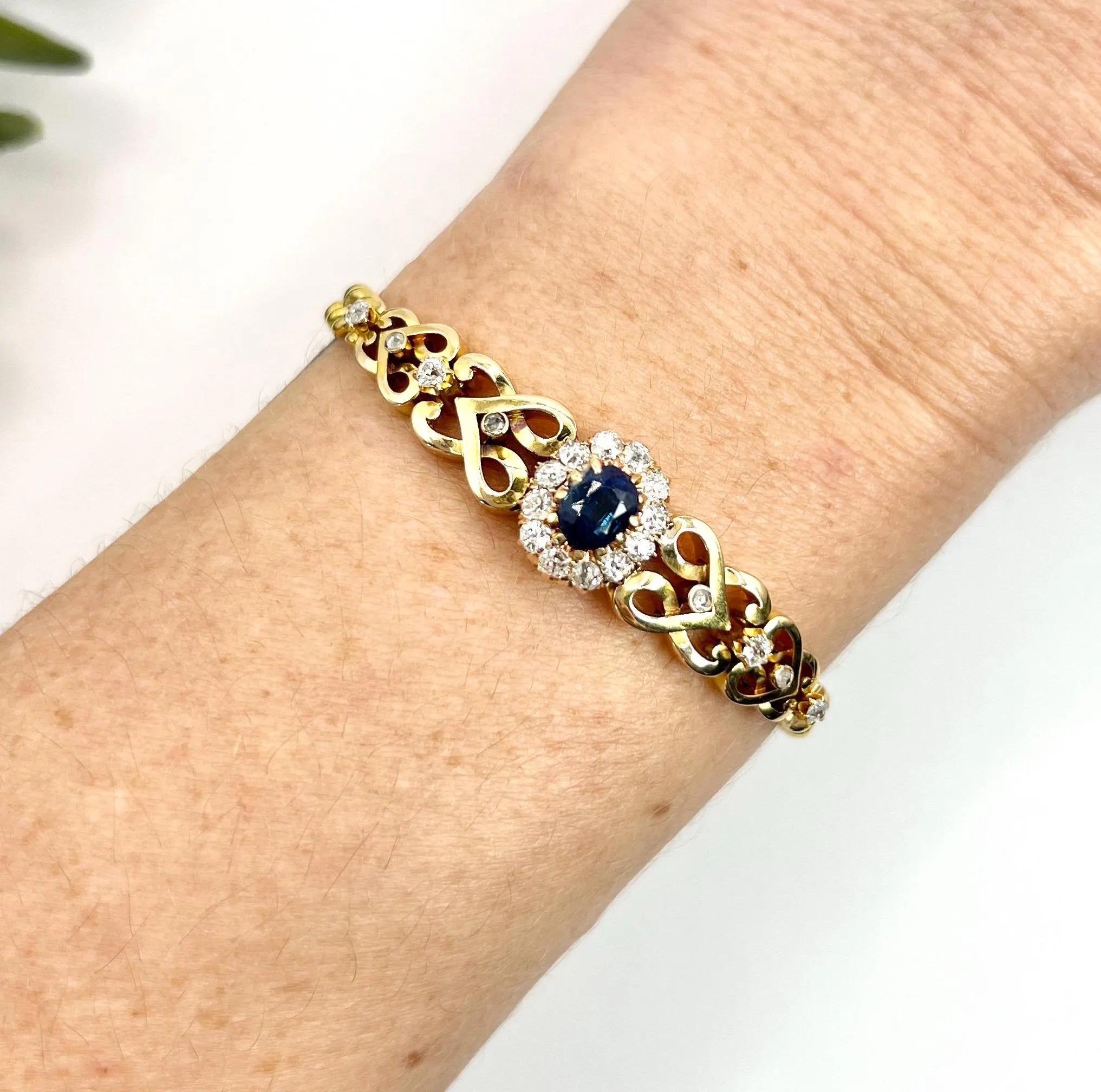 Antique Cluster Bracelet 

18ct Yellow Gold

Circa 1900

This exquisite 18ct yellow gold Edwardian bracelet is a stunning representation of vintage elegance. The focal point of the piece is a fabulous natural sapphire, beautifully surrounded by a