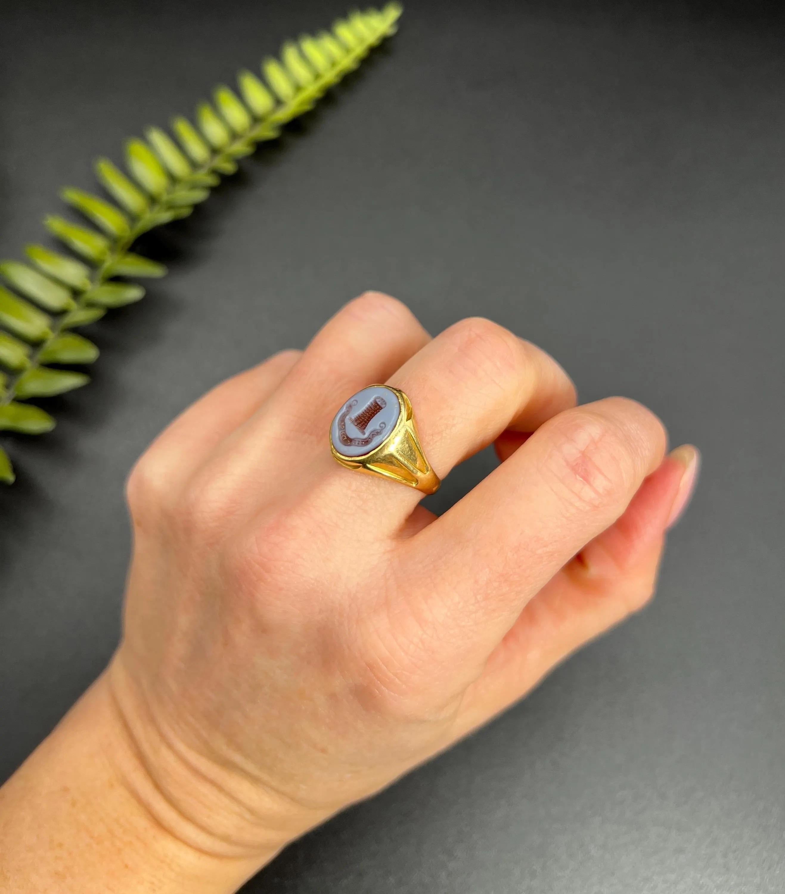 Antique Sardonyx Signet Ring

18ct Gold Stamped

Circa 1900

Step into elegance with this exquisite Edwardian signet ring, crafted from 18ct yellow gold. The ring features a stunning hand-carved sardonyx stone that beautifully showcases a family