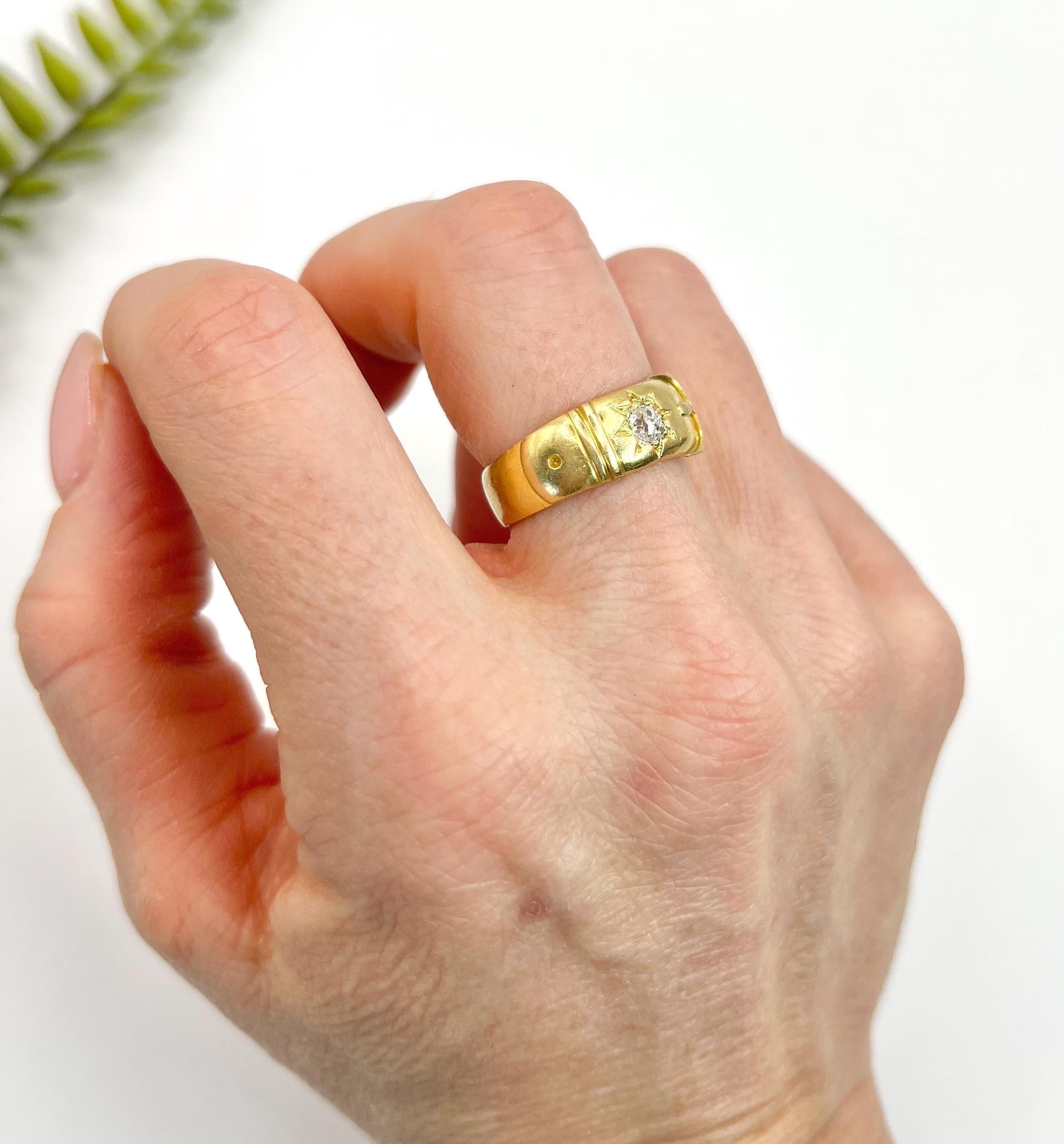 Antique Buckle Ring 

18ct Gold

Circa 1900

Makers Mark C G

This antique gold buckle ring is a timeless piece of jewelry that symbolises everlasting love, fidelity, and loyalty. It features a star-set natural diamond, and the buckle on the ring