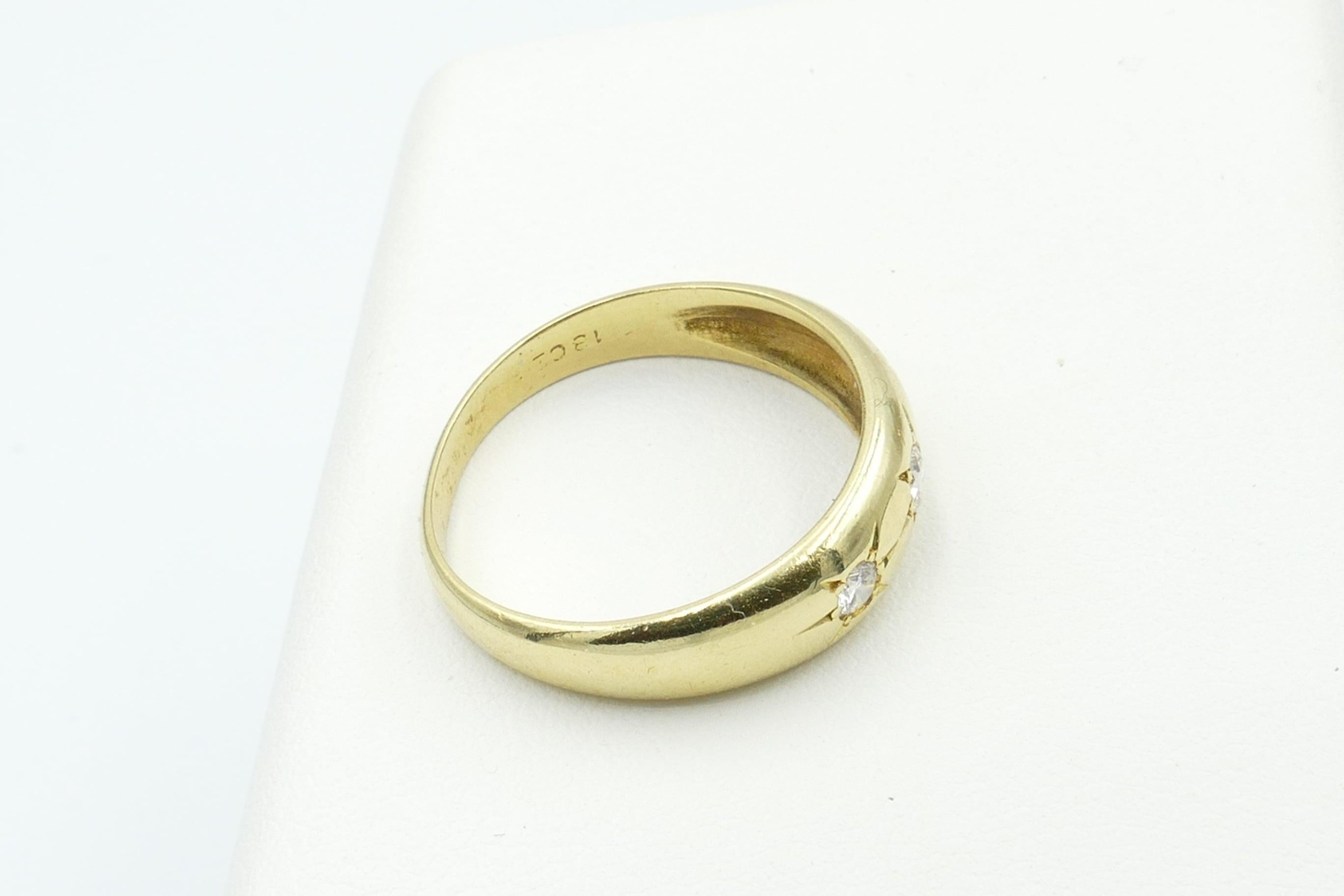 18 carat gold ring with 3 diamonds