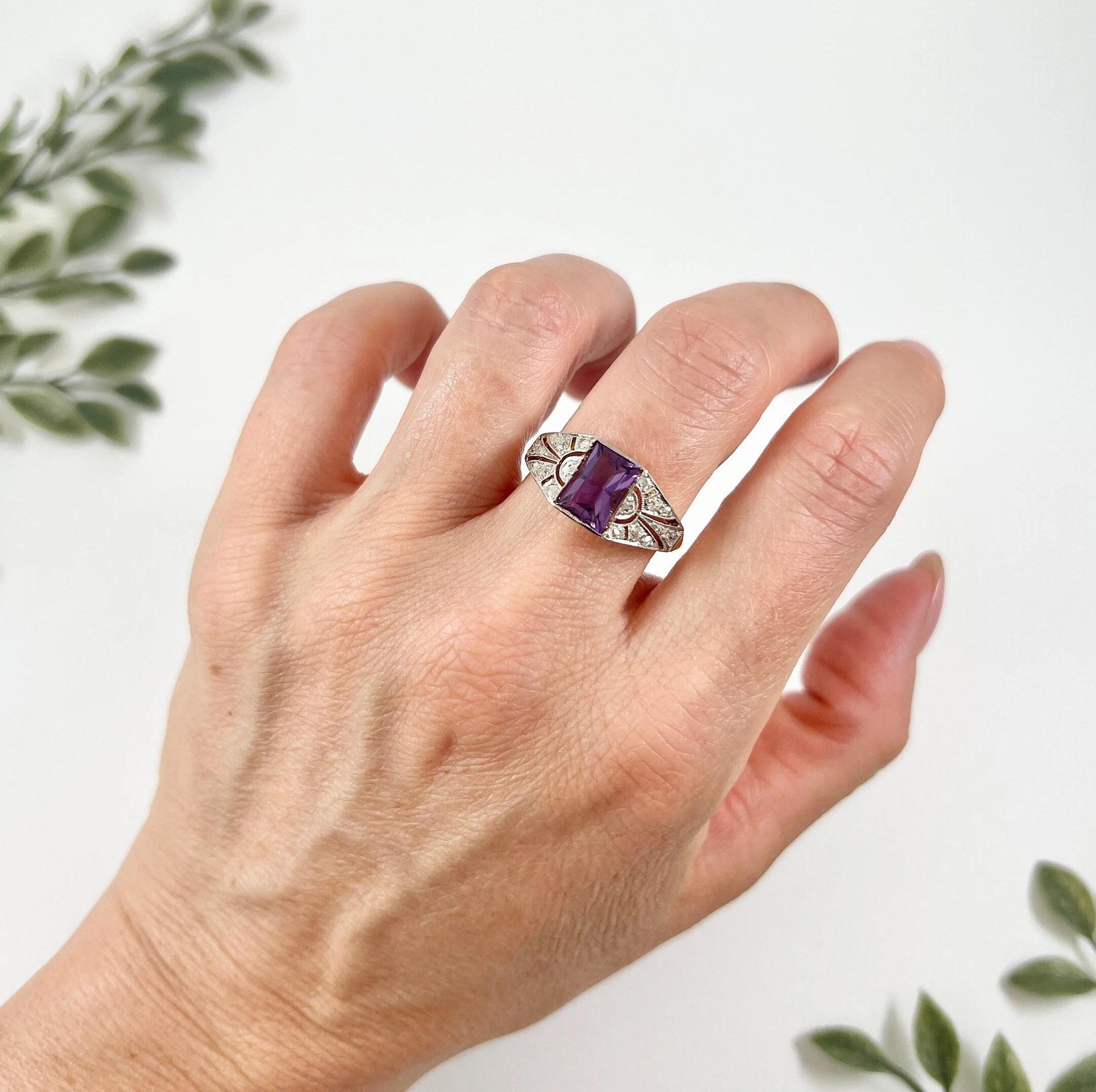 Antique Amethyst Ring

18ct Yellow Gold & Platinum Tested

Circa 1910

This stunning Edwardian-era ring features an exquisite emerald-cut amethyst set in a platinum open work setting. The intricate design is adorned with natural rose-cut diamonds,