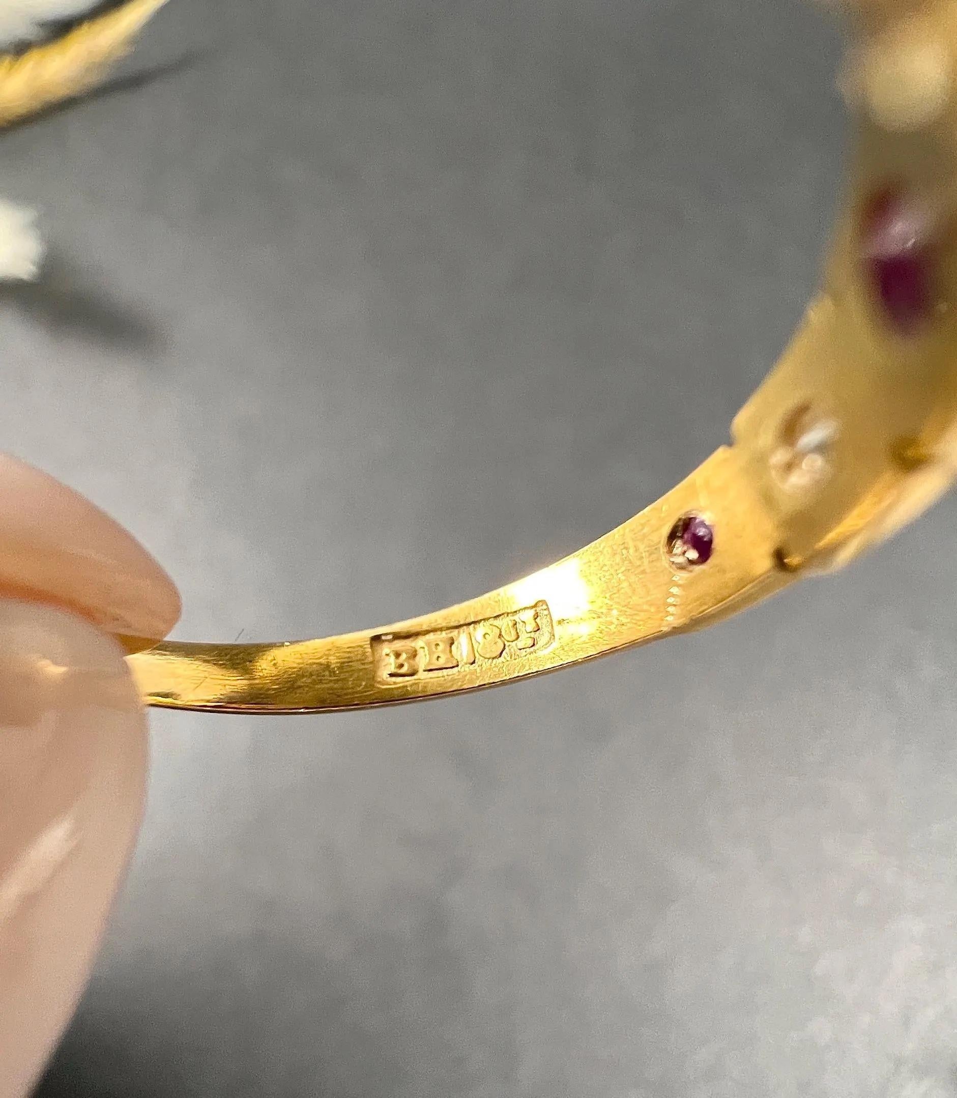 Antique Ruby & Diamond Ring 

18ct Gold Stamped 

Circa 1890

Makers Mark B H 

Introducing a stunning 18ct gold Victorian five-stone ring, featuring alternating natural rubies and diamonds, each stone set flush within a square setting. This