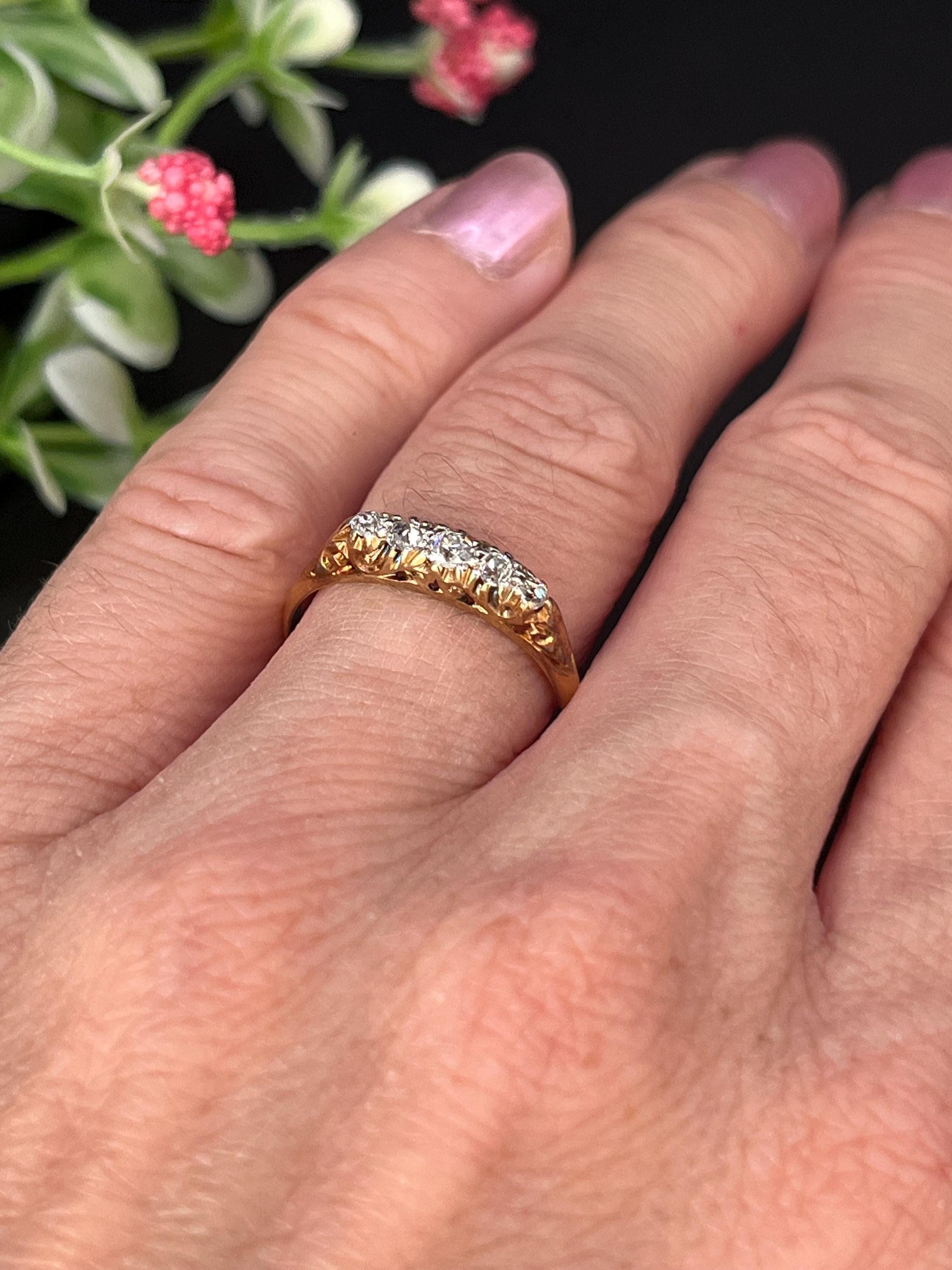Antique Victorian Diamond Ring

18ct Yellow Gold 

Makers mark H. L.B

Stamped 18ct 

Circa 1880

This exquisite five-stone diamond ring whispers of devotion and craftsmanship. Set in warm antique gold, the graduated old-cut diamonds shimmer with