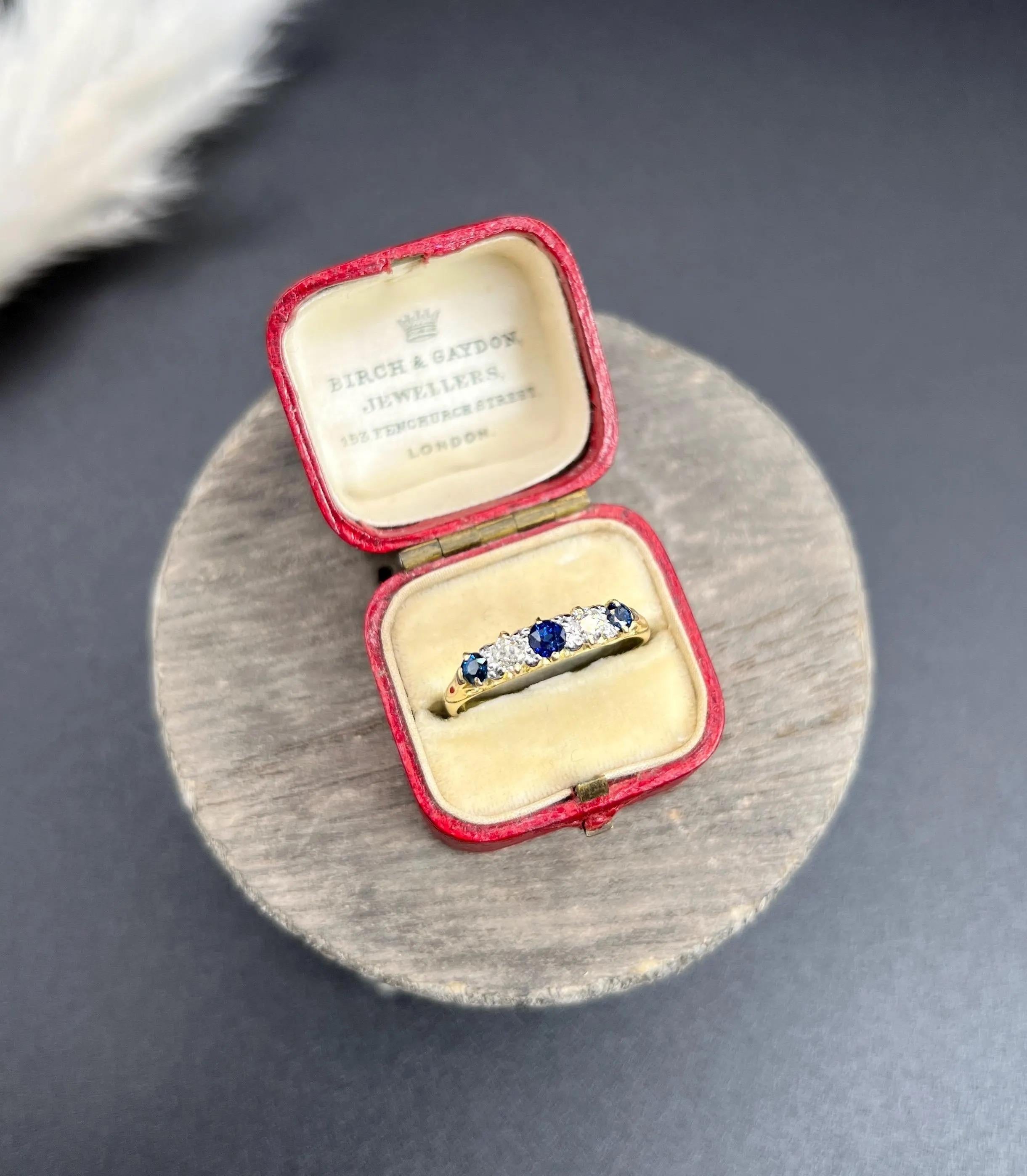 Antique Carved Ring 

18ct Gold Stamped

Circa 1880

Indulge in the elegance of this exquisite Victorian five-stone ring, meticulously crafted in 18ct yellow gold. This stunning piece showcases a beautiful hand-carved setting, highlighting