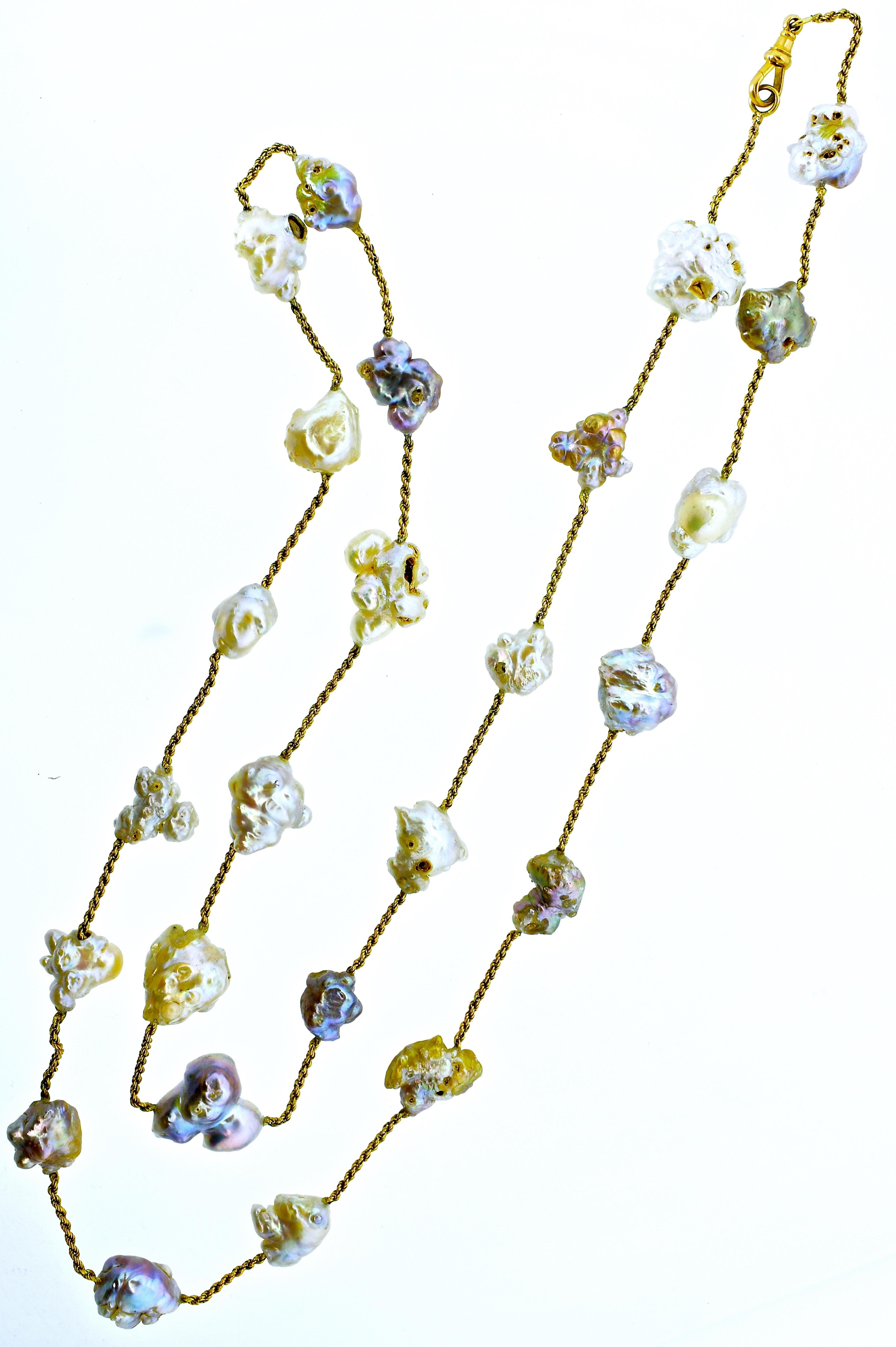 Antique 18K gold chain interspersed with natural fresh water baroque pearls ranging in size from 8 mm up to 22 mm.  These pearls are quite fine and unusual because they were farmed before pollution affects and therefore are large, show a rainbow of