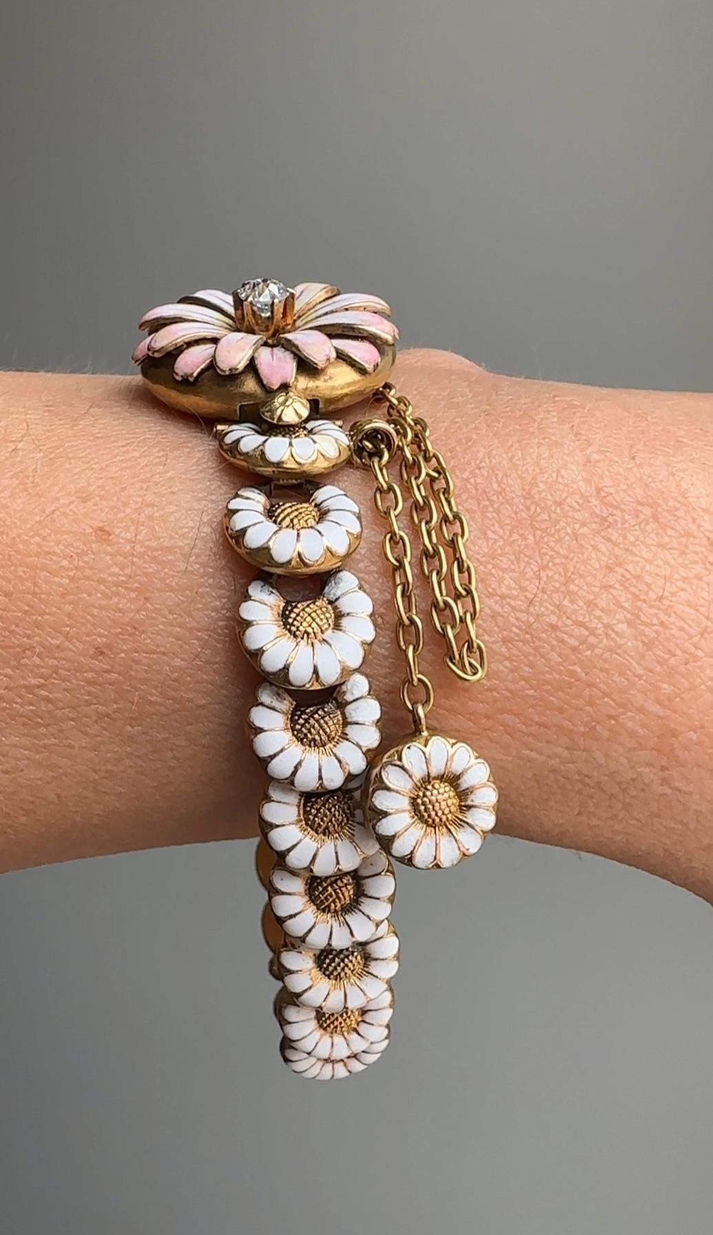 Utterly romantic and exceptionally rare - this delightful late 19th century bracelet is like a is a summer wreath of daisies to wear around your wrist. Masterfully modeled in 18 karat gold, the daisy centerpiece / clasp is set with a single