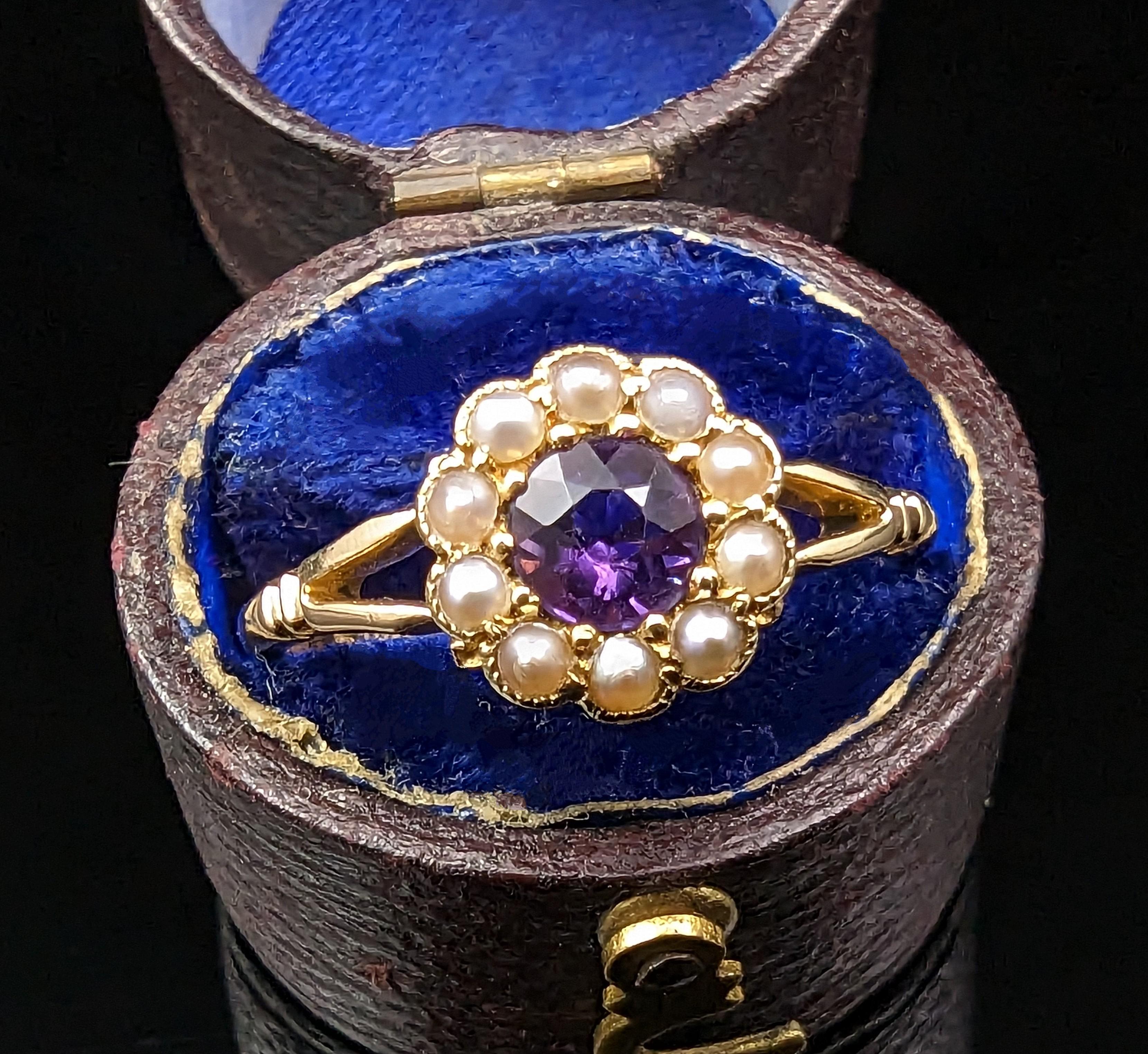 This pretty antique Amethyst and seed pearl cluster ring is delicately charming and oh so sweet.

We love it's soft floral design and vibrant lush amethyst, set to the centre and surrounded by a halo of creamy seed pearls.

The ring is crafted in