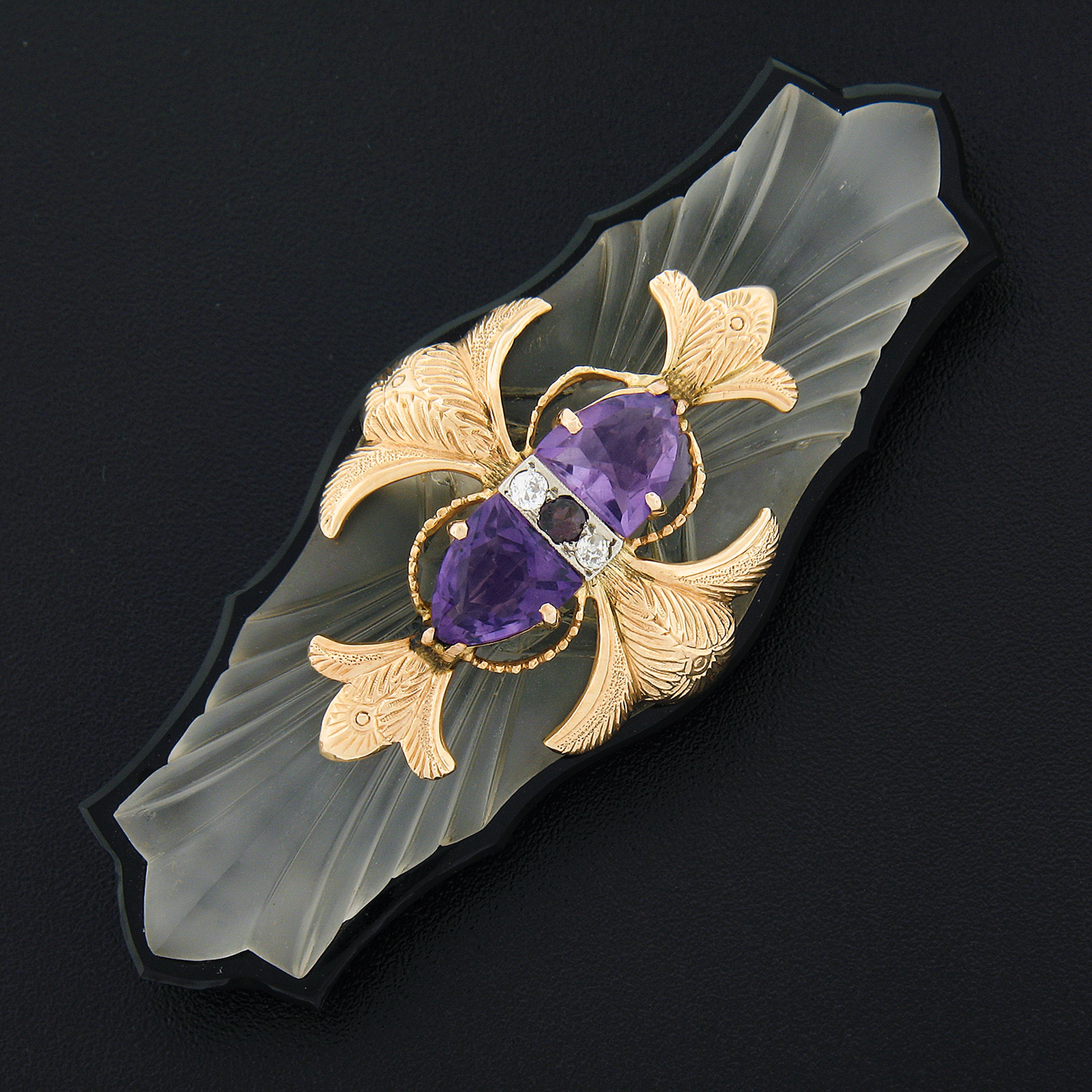 This large antique brooch features custom cut natural amethysts and diamonds that are set onto the 18k rose gold and decorated with gorgeous etched floral center piece that is then attached onto the carved and frosted camphor glass sitting on top of