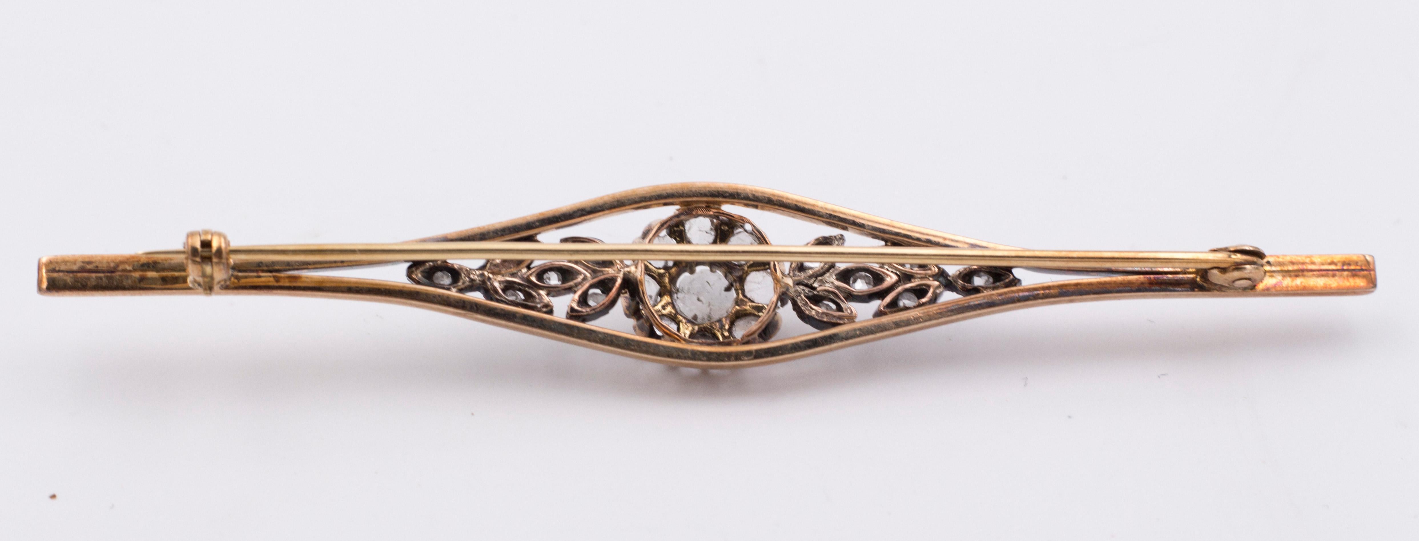 An antique brooch, dating from the early 20th Century, modelled in 18K gold throughout; the brooch features a beautiful floral central decoration, set with rose cut diamonds. 

MATERIALS
18K gold and rose cut diamonds

DIMENSIONS
Length: 8.3