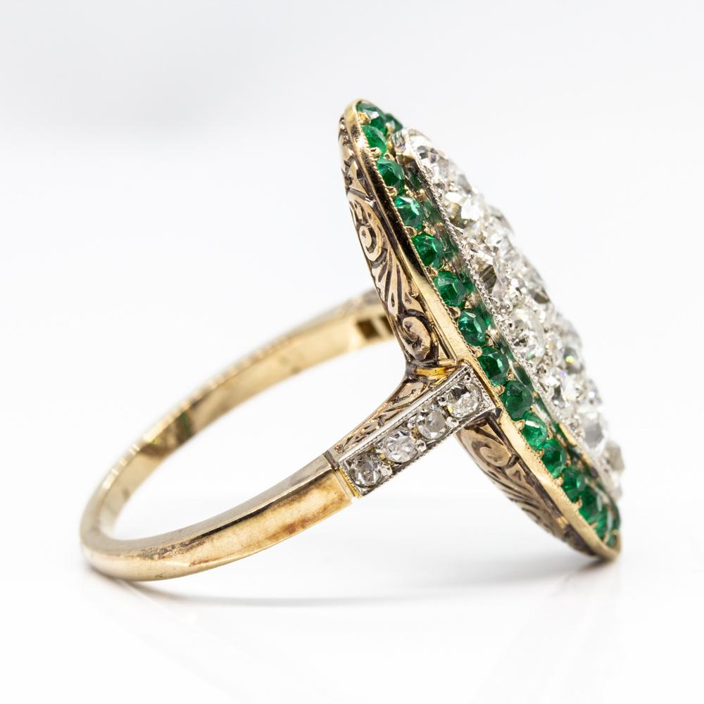 This is a gorgeous marquise shape ring that showcases old mine cut diamonds H-VS2/SI1 quality that weigh 1.90ctw.
Handmade in 18k gold and platinum, this exquisite piece of jewelry displays natural old mine cut emeralds that weigh 1.20ctw
Ring size: