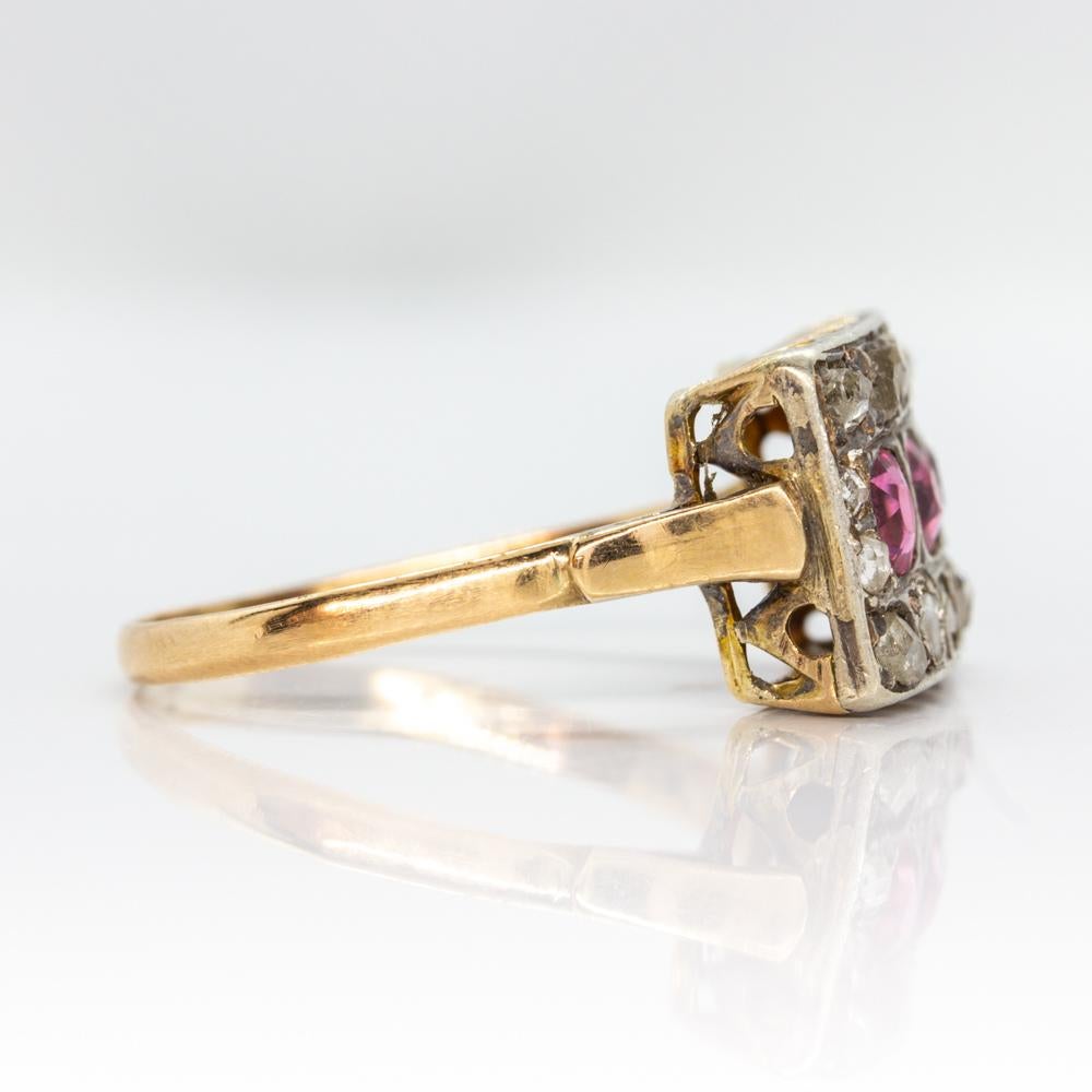 This is a unique piece of jewelry that displays a Victorian style. 
Three cushion cut natural rubies that weigh 0.50ctw constitutes the central stones of this fabulous ring.
Surrounding the central stones, this exquisite piece of jewelry displays 14