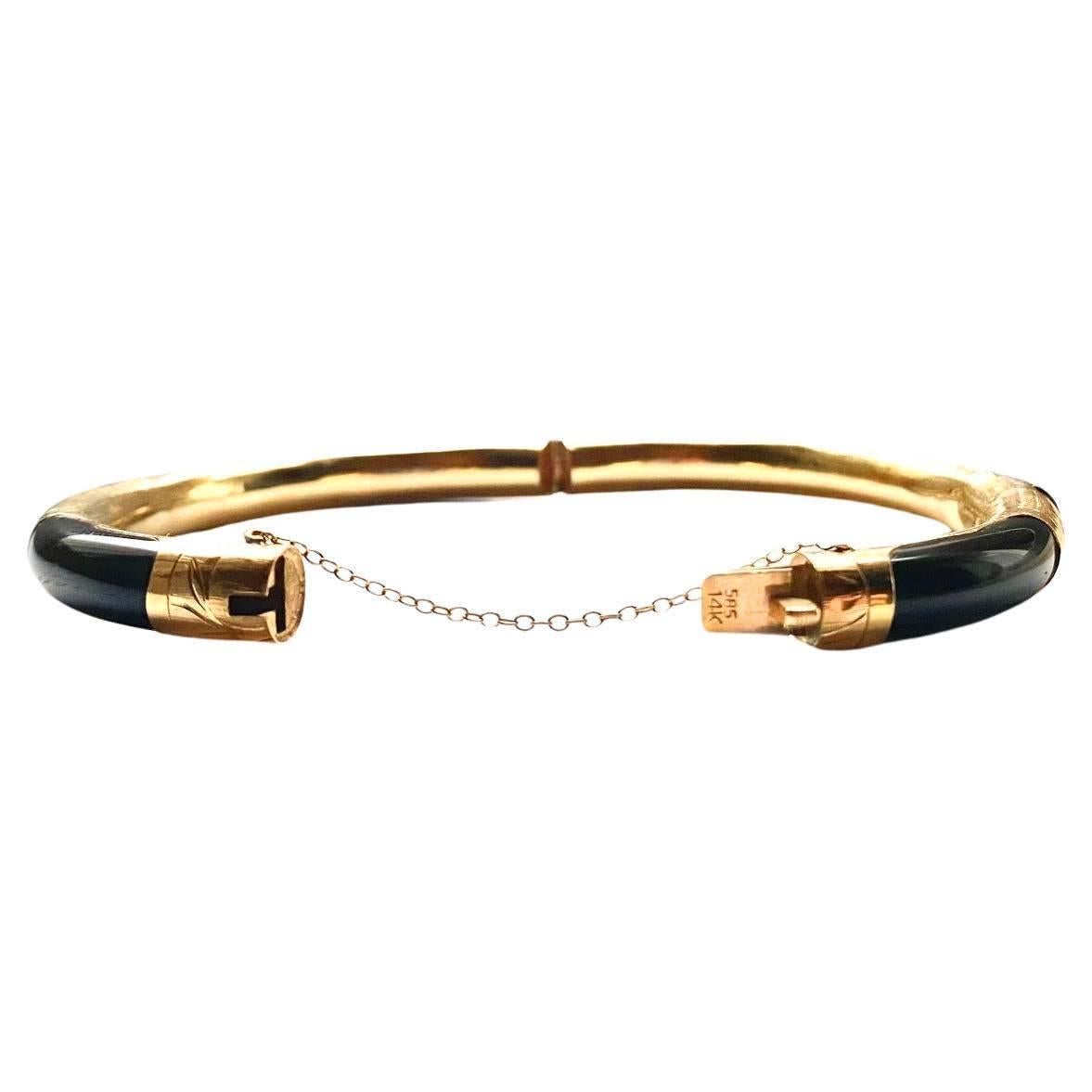 14K Gold Antique bracelet bangle, beautifully carved on gold, onyx detailing, Black Onyx Bangle Bracelet with Gold Clasp 18K Gold fittings (stamp on clasp) 

Circumference inside when bangle is closed: 6.75 in (17.15 cm) Diameter inside when bangle
