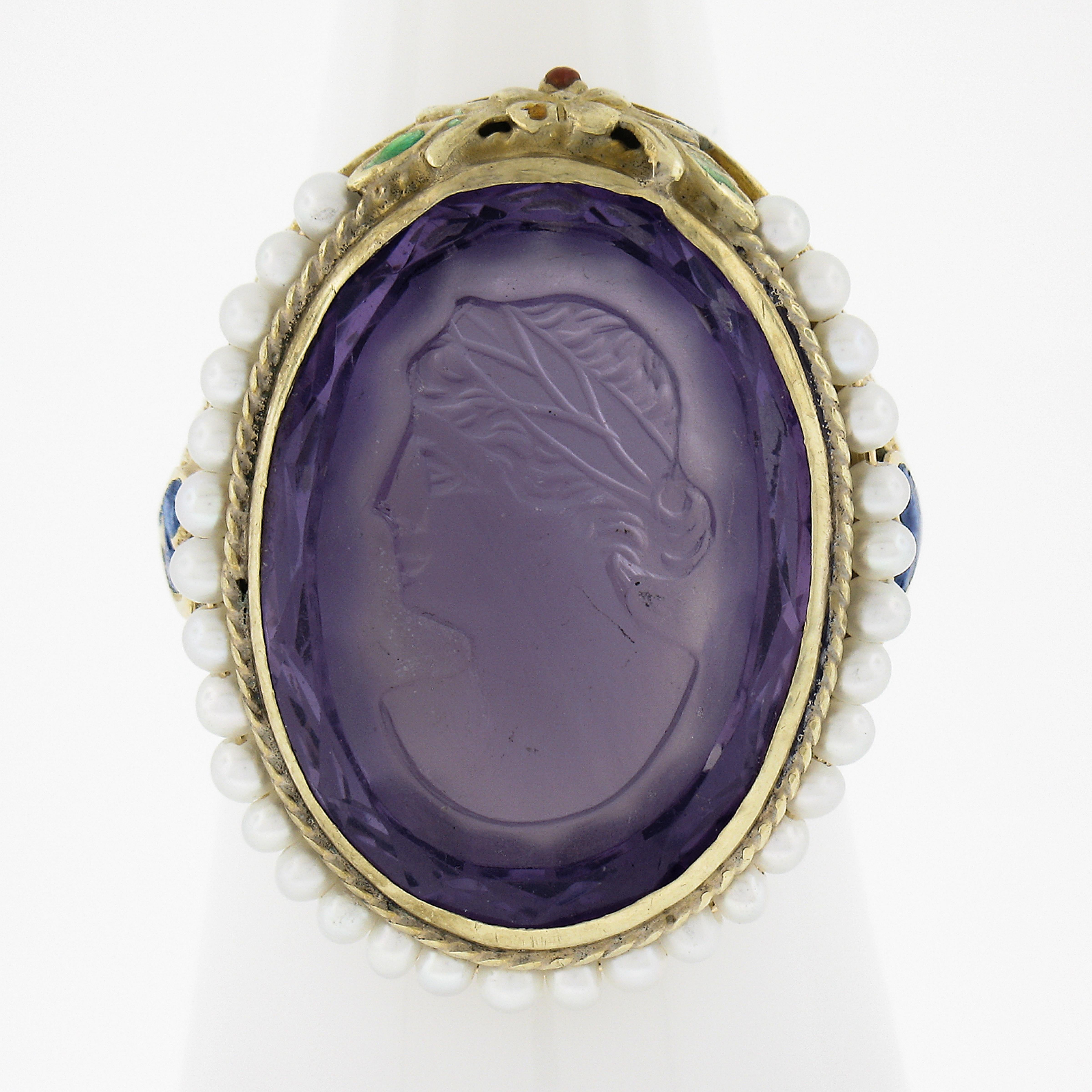 --Stone(s):--
(1) Natural Genuine Amethyst - Carved Cameo Oval Cut - Bezel Set - Medium Purple Color - 21.2x15.6mm (approx.)
Numerous Cultured Seed Pearls - Round Shape - Wire Set - White Color - 1.8mm each (approx.)

Material: Solid 18k Yellow