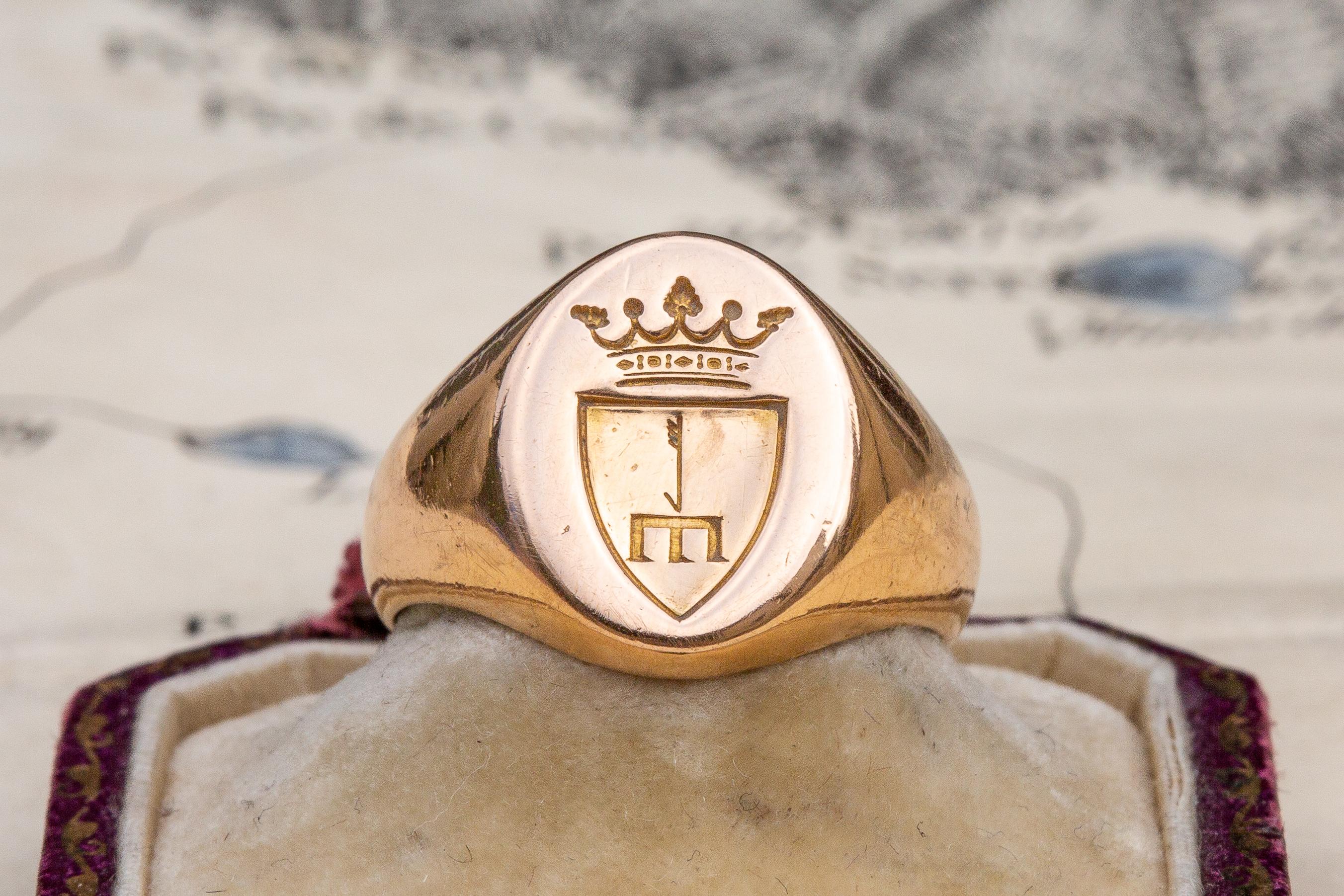 An impressive, scarce and heavy late-19th century hand engraved intaglio signet ring. The bezel is intricately carved to depict a Polish or Eastern European coat of arms. Based on the coronet above the shield we can deduce that this coat of arms