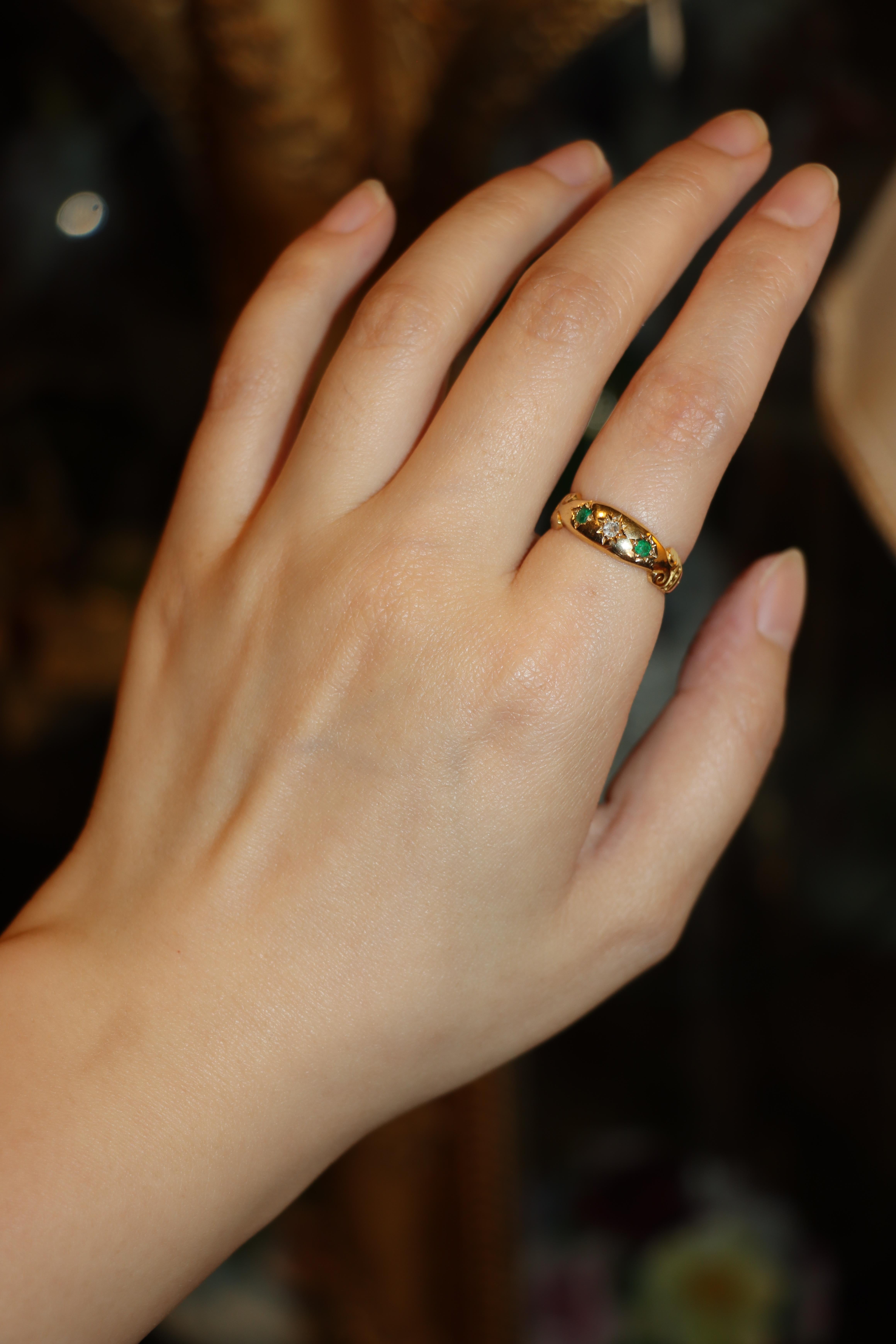 Antique 18K Gold Diamond Emerald Ring

Marked:
18

Approximate Dimensions:
6.25 (Ring Size) 
0.6 cm (Width)
0.04 carat (Diamond)
0.08 carat (Emerald)
3.1 grams in weight.

** All dimensions listed above are approximations based on our measurements