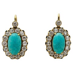 Boucles d
oreilles anciennes en or 18K avec turquoise de Nishapur (Shajareh) et halo de diamant -