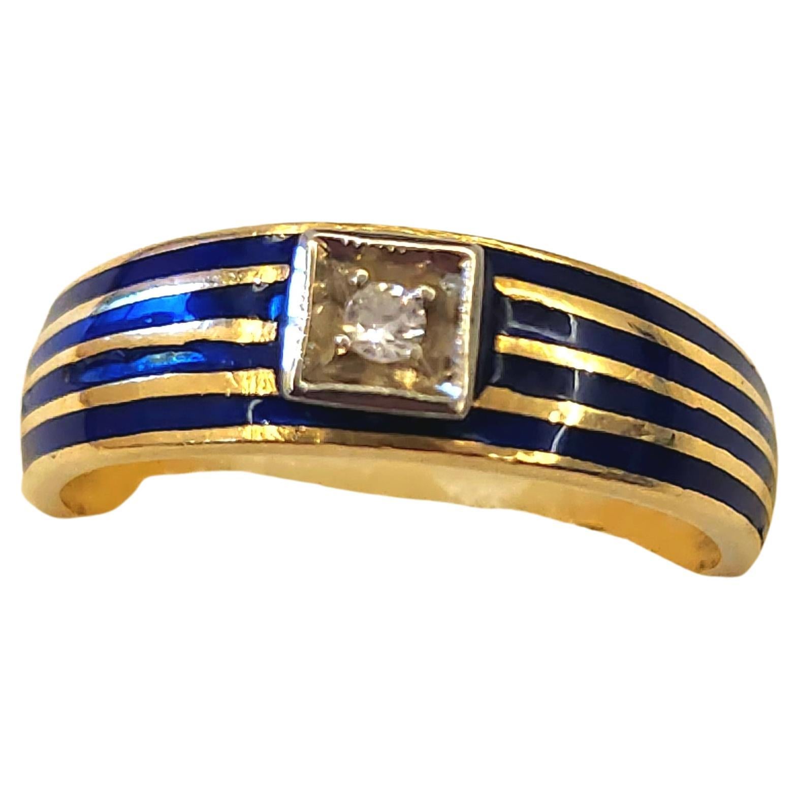 Antique 18k gold unisex in style centeted with 1 old mine cut diamond decorted with navy blue enamel colour stripes ring dates back to europe 1900/1910.c hall marked 750 for 18k gold purity