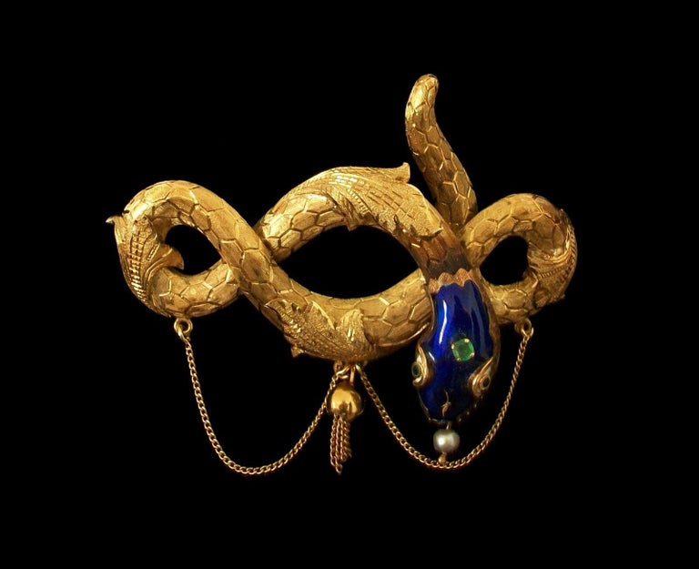 Antique Victorian/Napoleon III 18K yellow gold serpent/snake brooch - fine and elaborate chased gold finish to the body with chain and tassel details - hand made featuring blue enamel head with contrasting enamel eyes - claw set with one round mixed